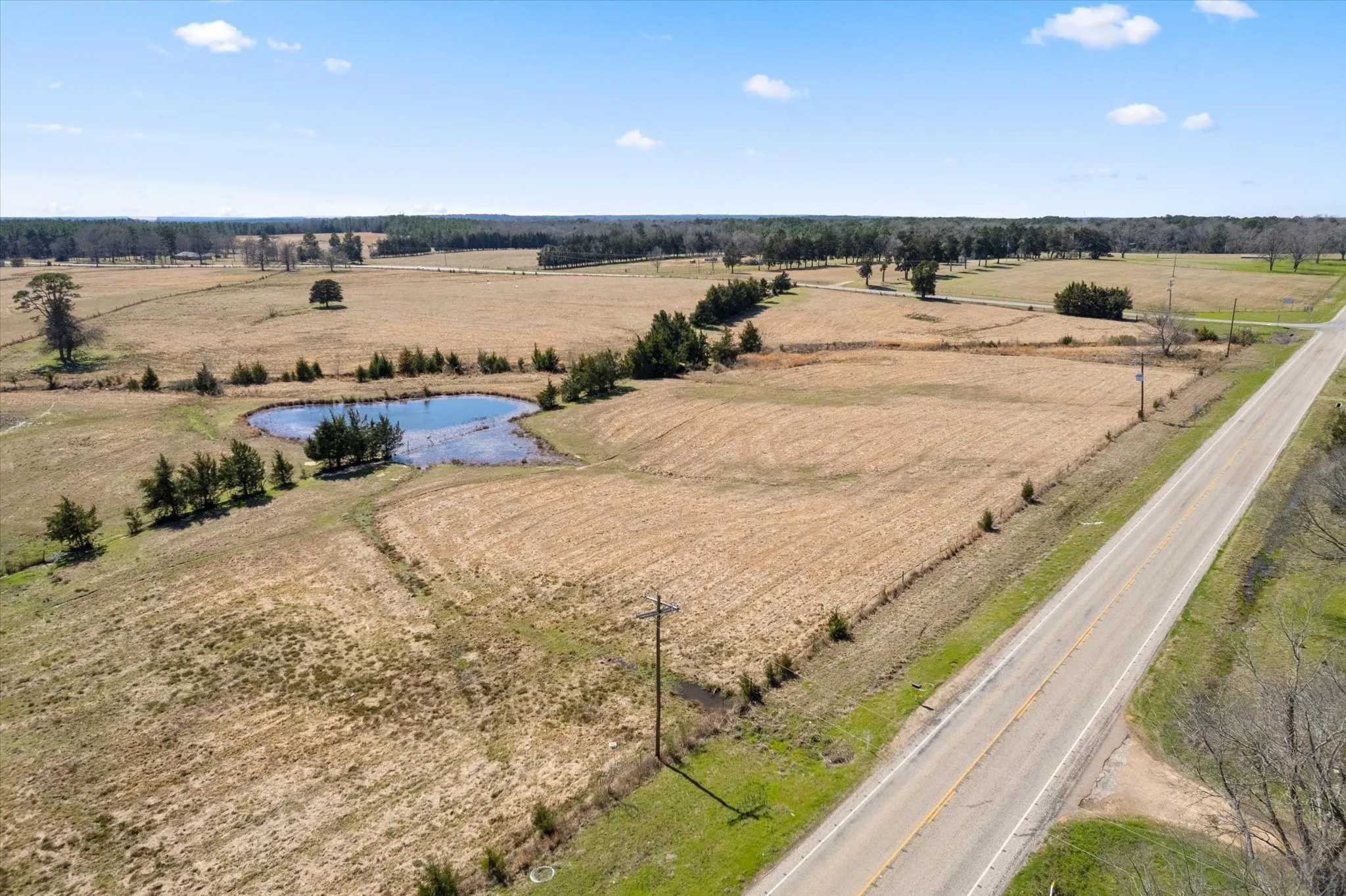 Birds eye view of property with a rural view and a water view