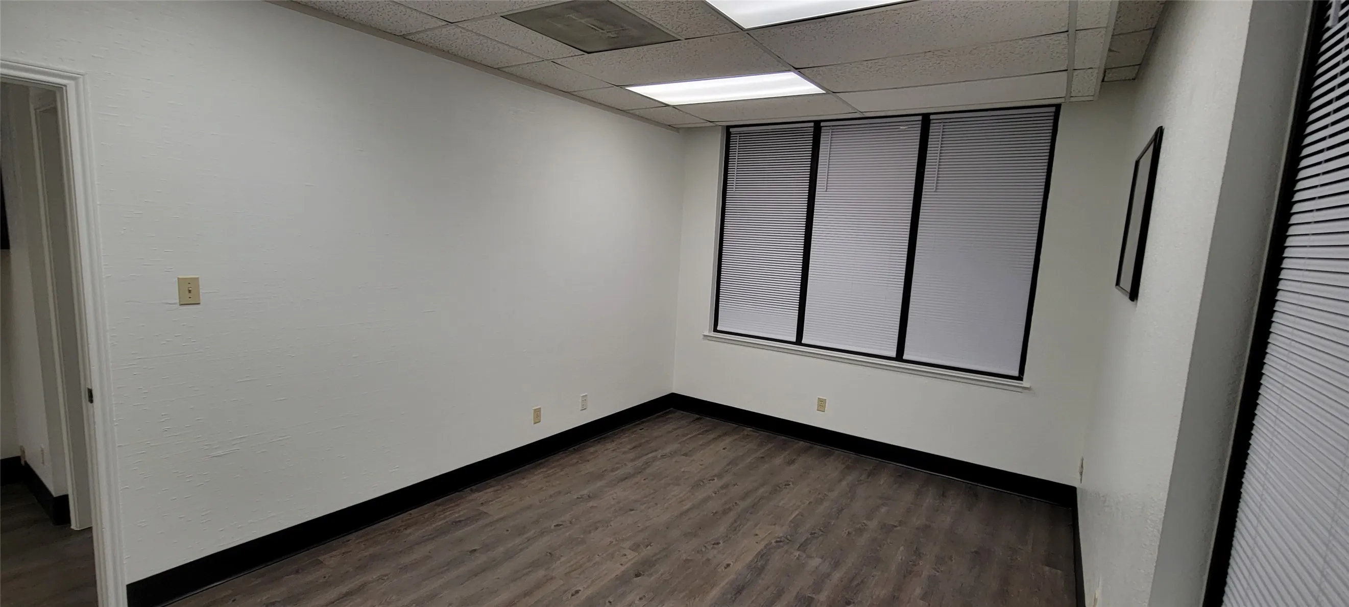 Office 2 showing floor, blinds and plenty of windows