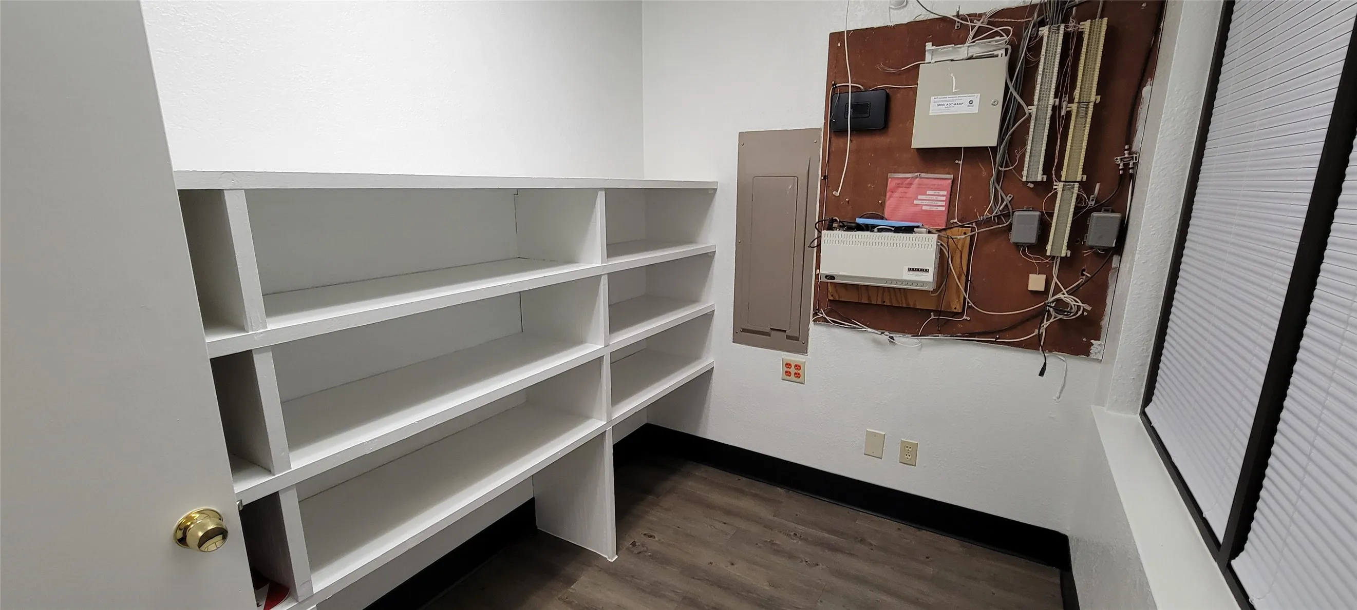 Electrical room with built in shelving