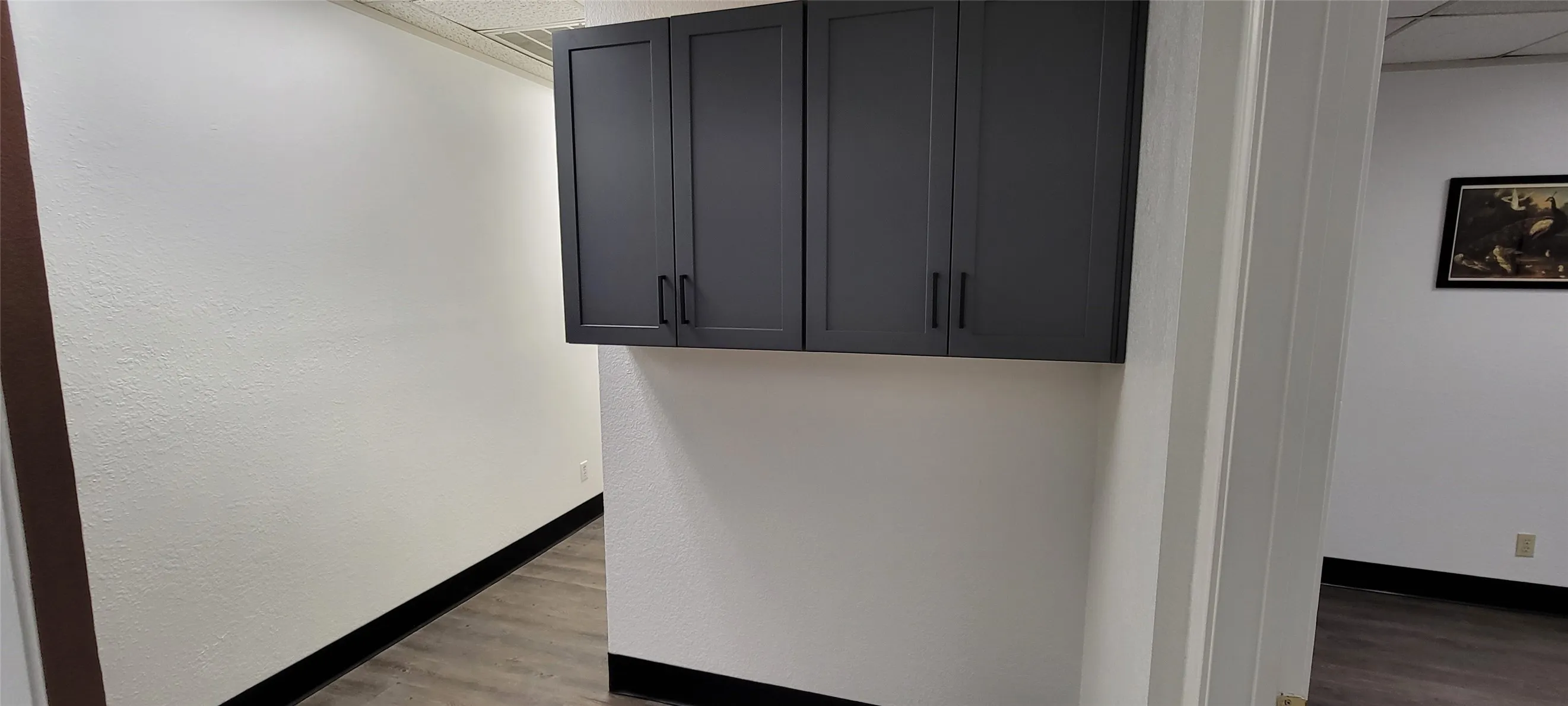 Second set of cabinets over an ideal location for printer or mail