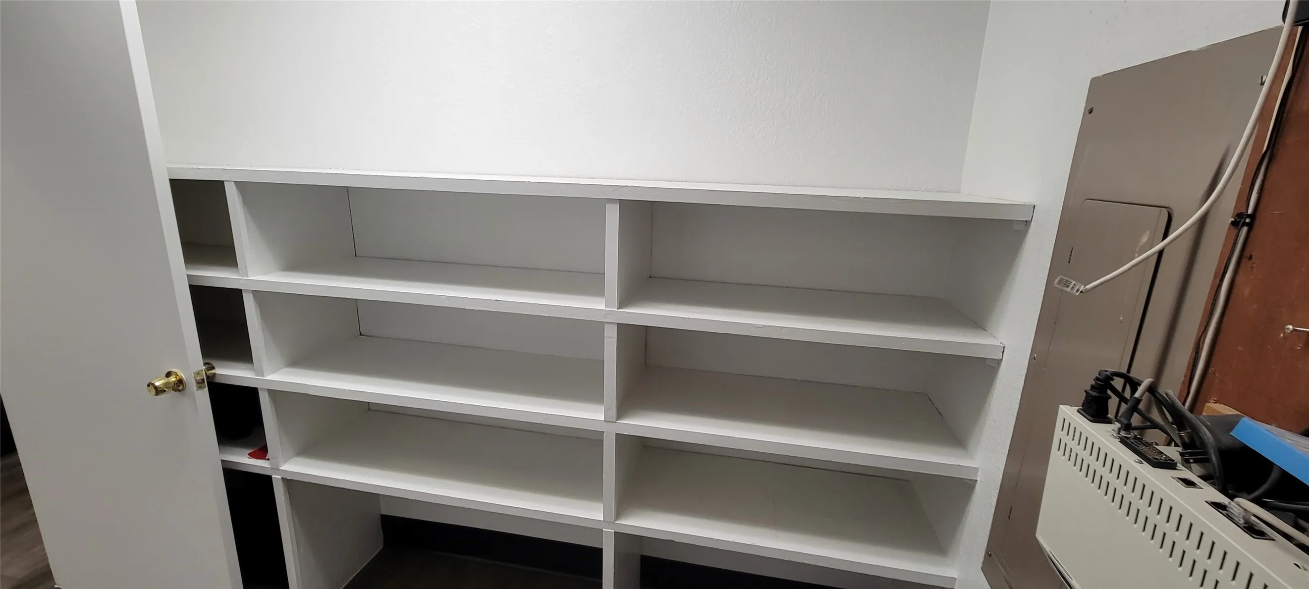 Electrical room with built in shelving