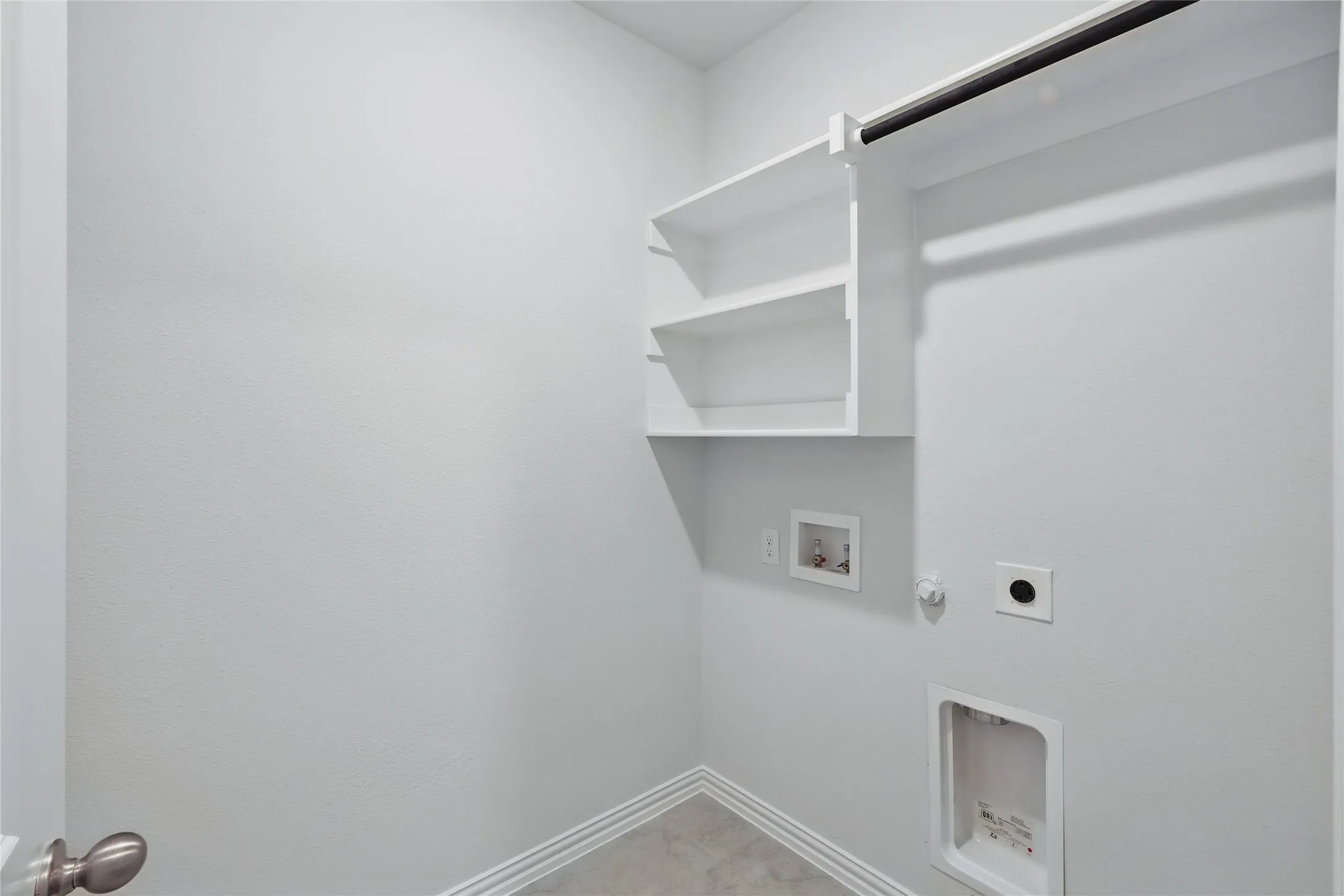 Washroom featuring hookup for a gas dryer, electric dryer hookup, and hookup for a washing machine