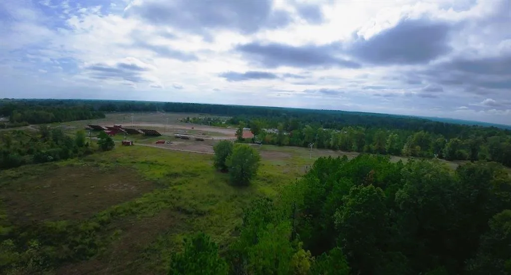 Birds eye view of property with a rural view