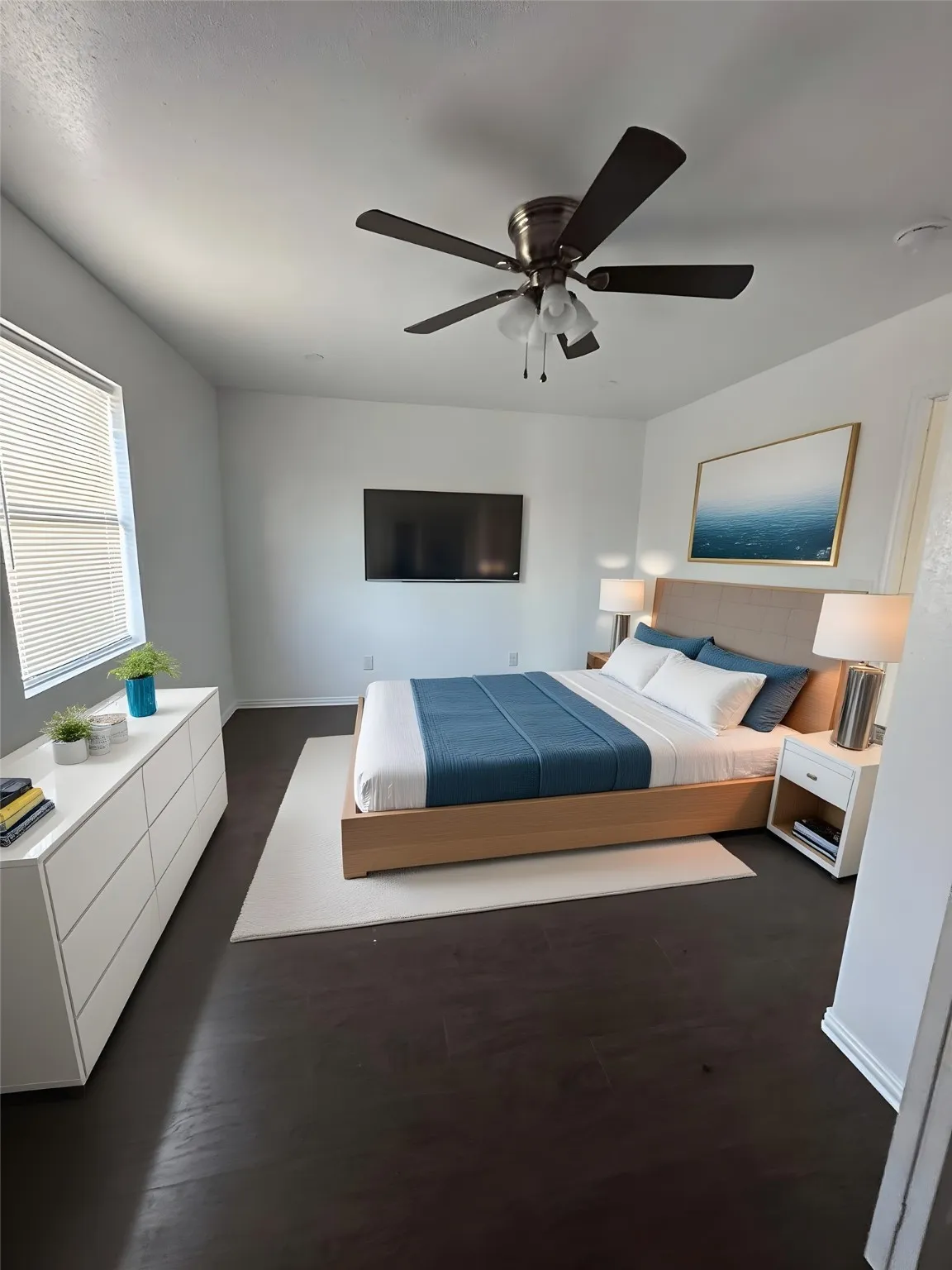 Bedroom featuring ceiling fan and dark wood-style floors