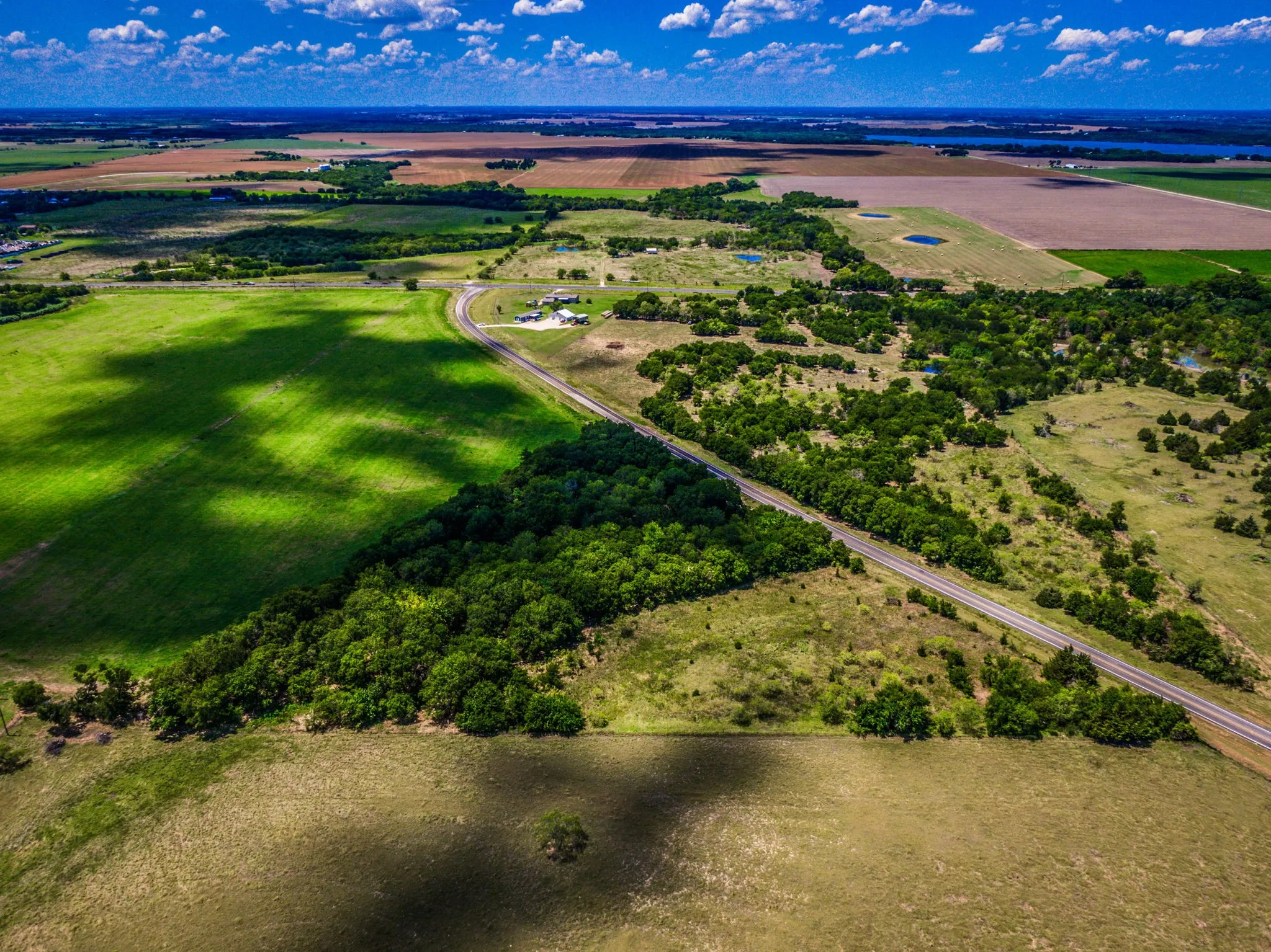 Birds eye view of property with a rural view