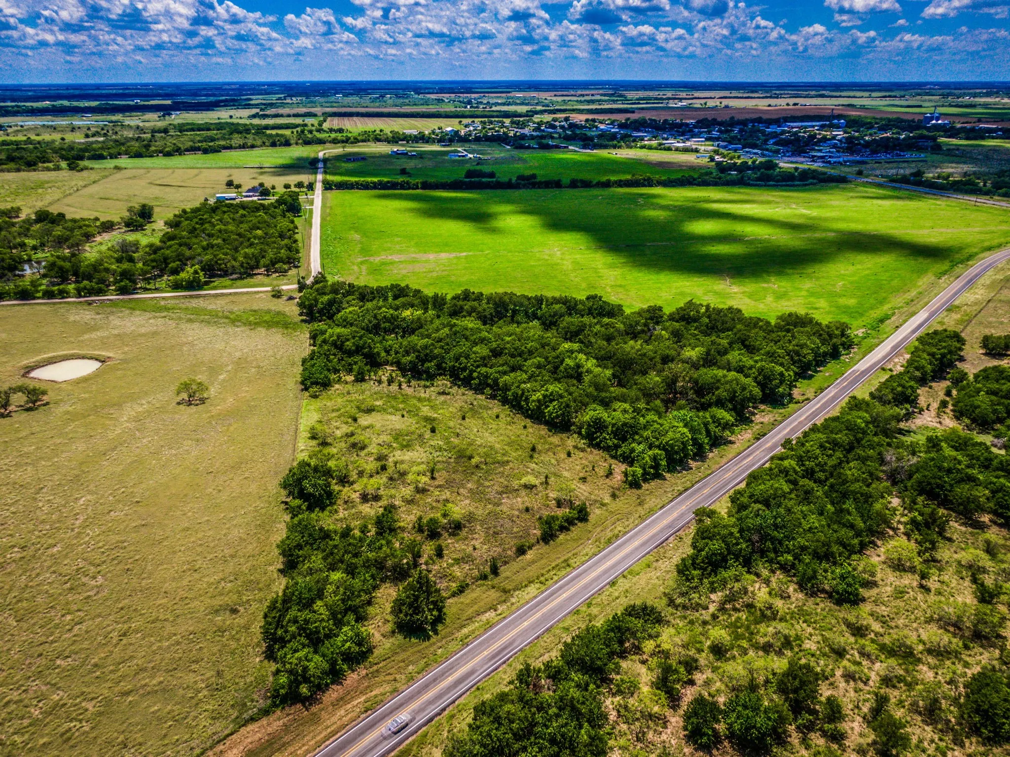 Birds eye view of property with a rural view