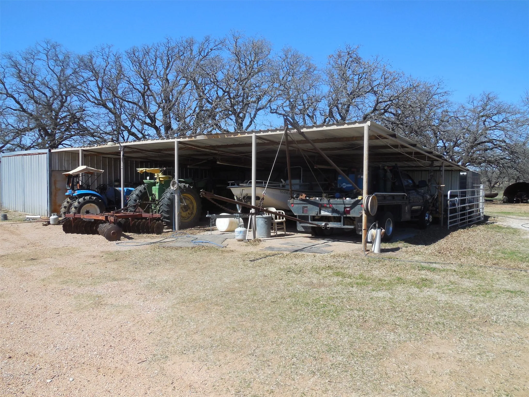 View of car parking featuring a carport