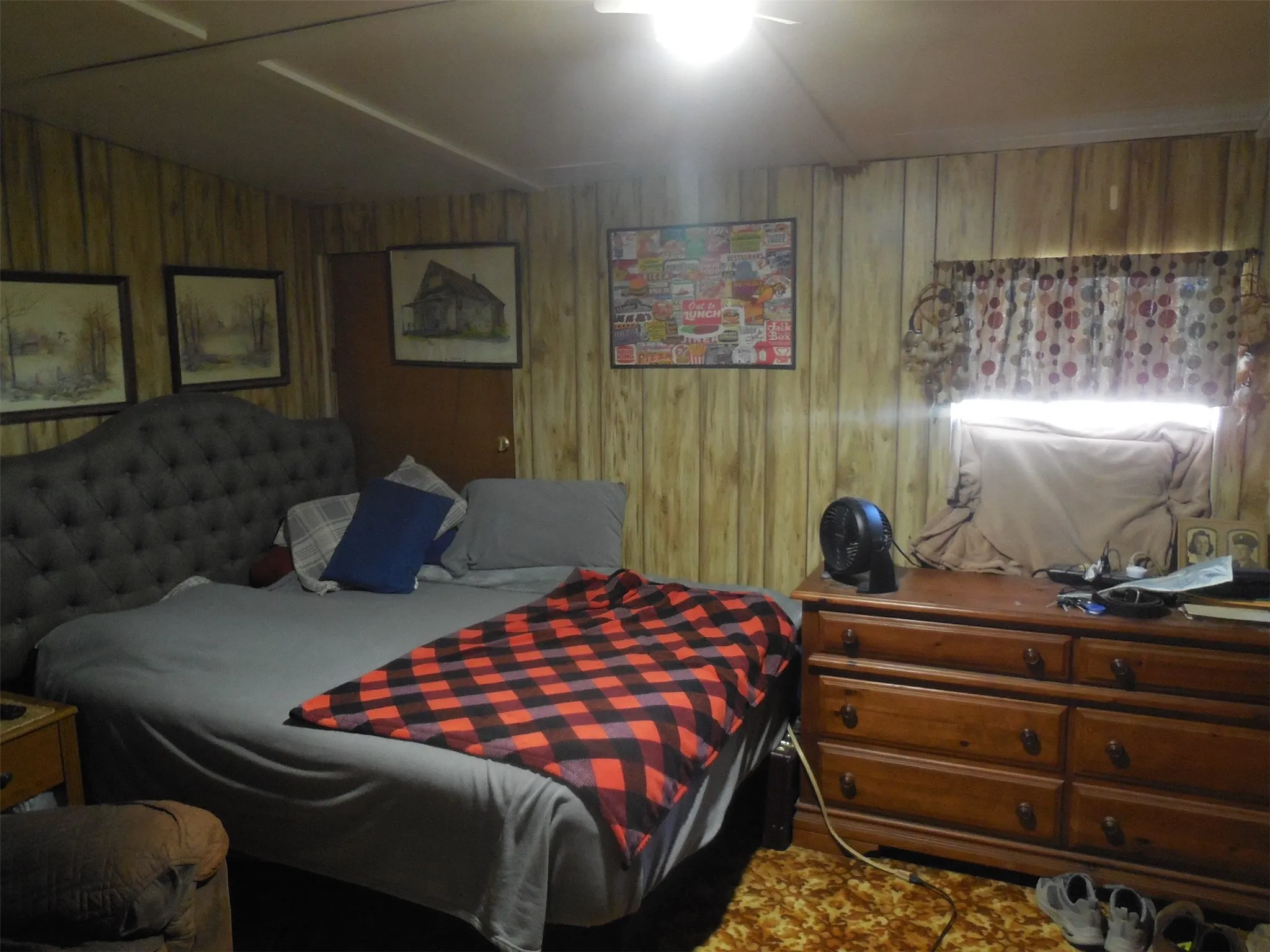 Bedroom with wooden walls