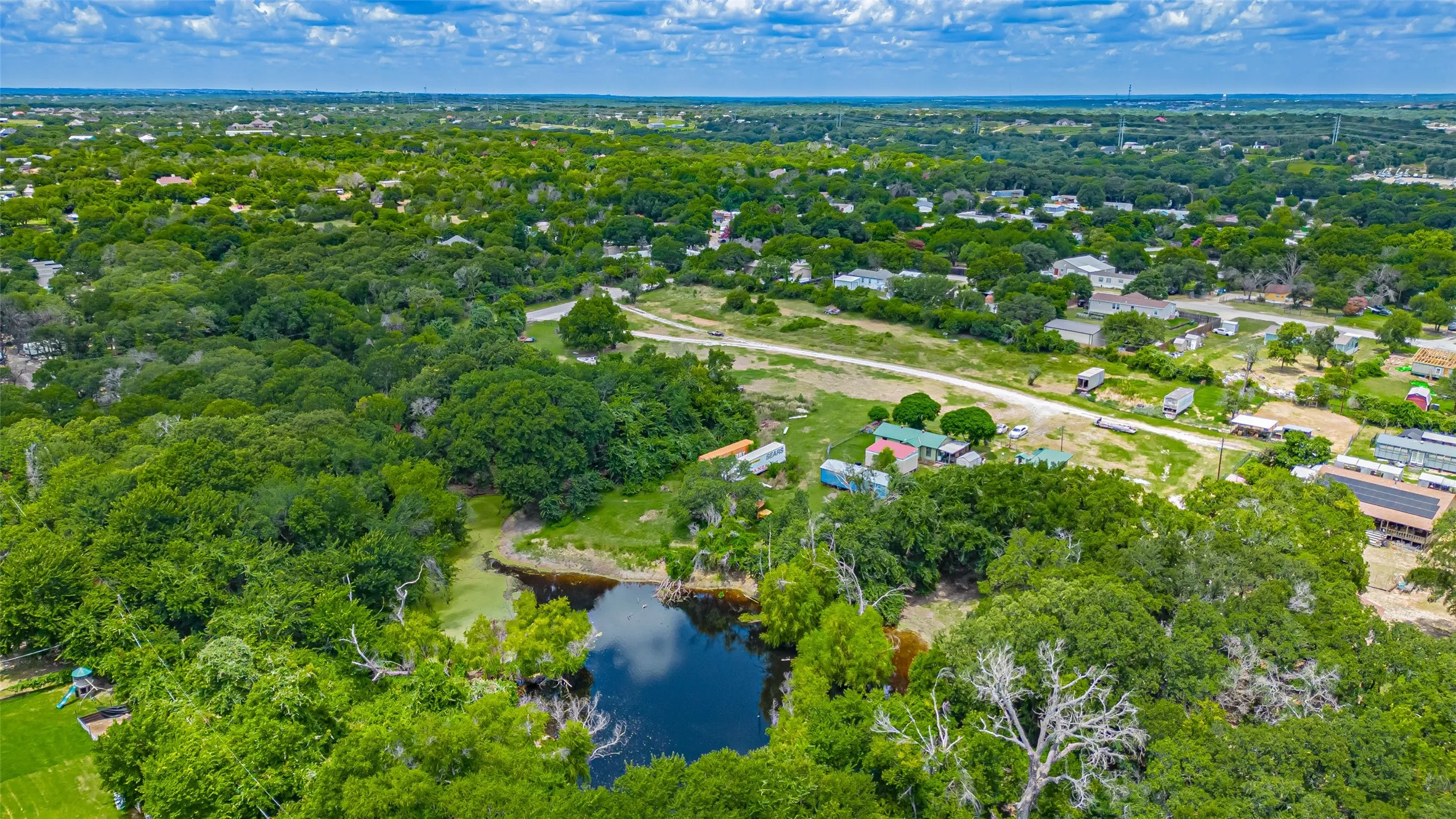 Aerial view of property's location featuring a nearby body of water