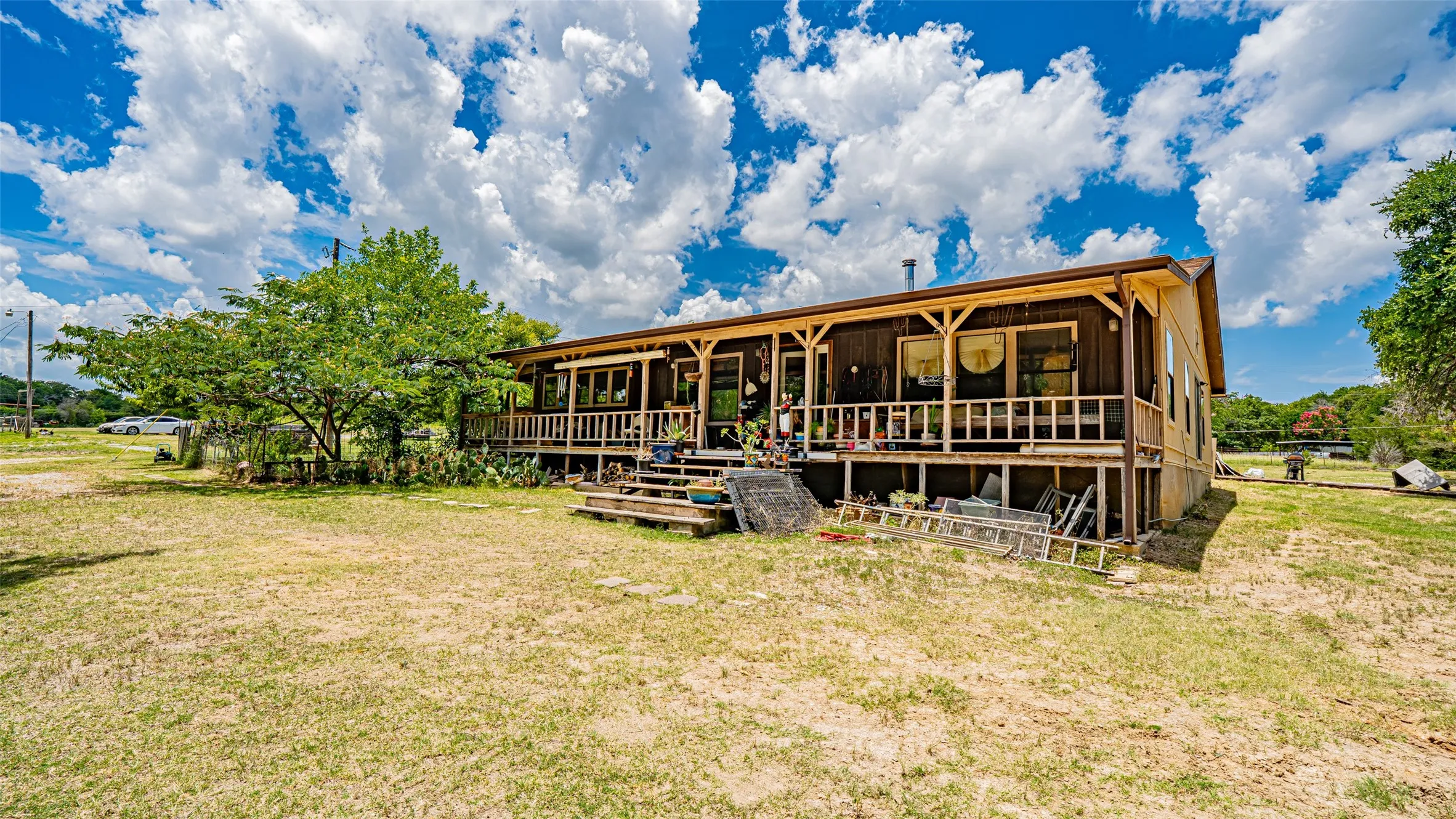 Rear view of property featuring a yard