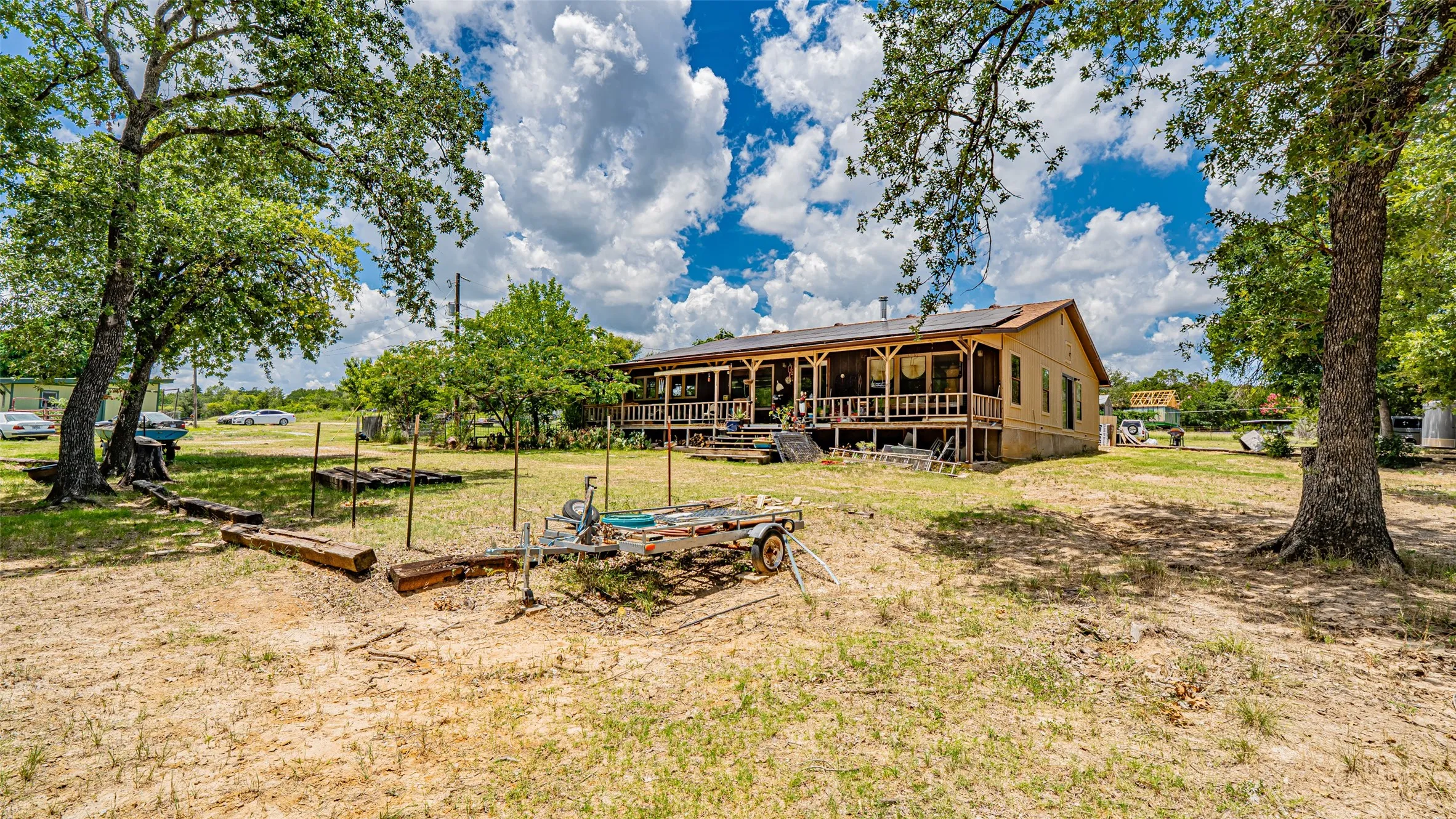 Rear view of property featuring a yard
