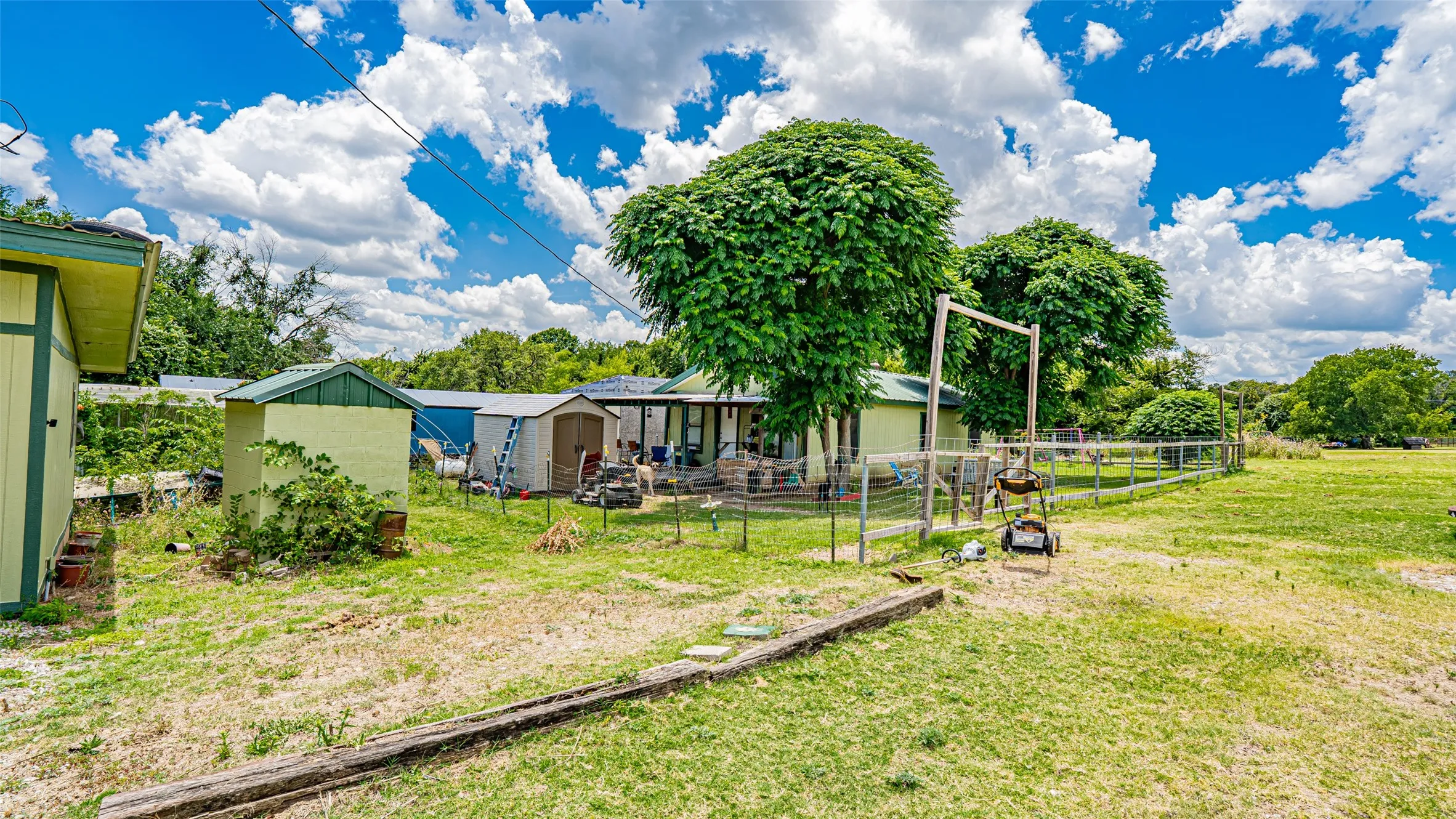 View of yard featuring a storage unit