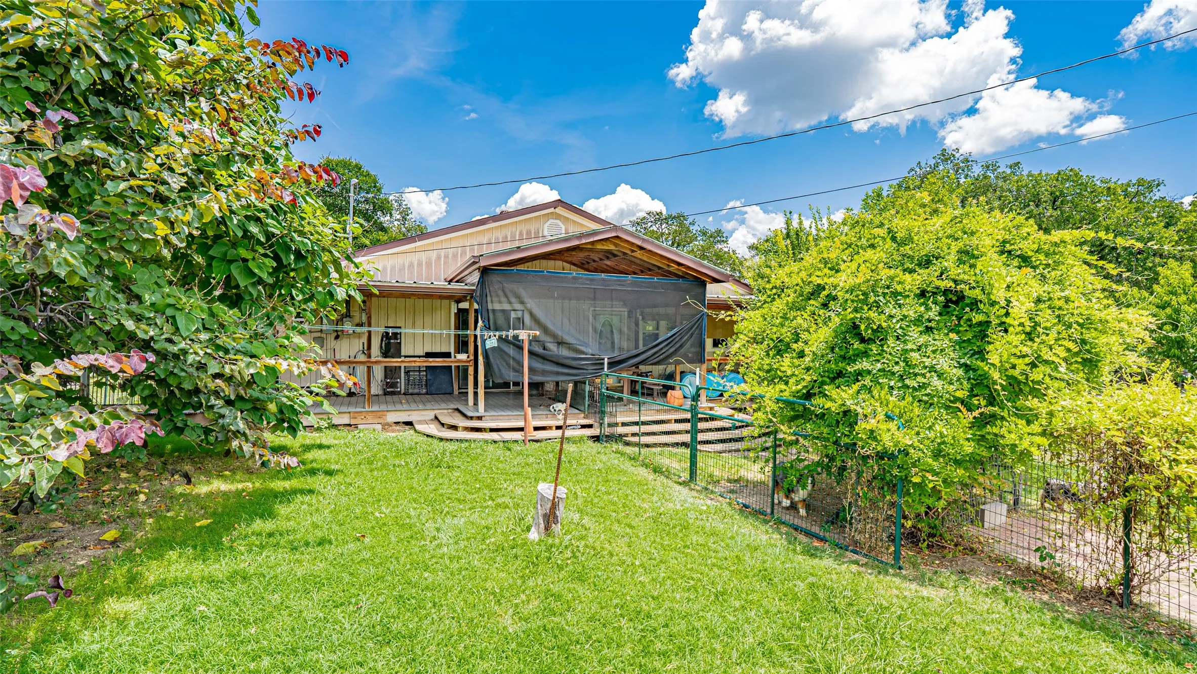 View of yard with a deck