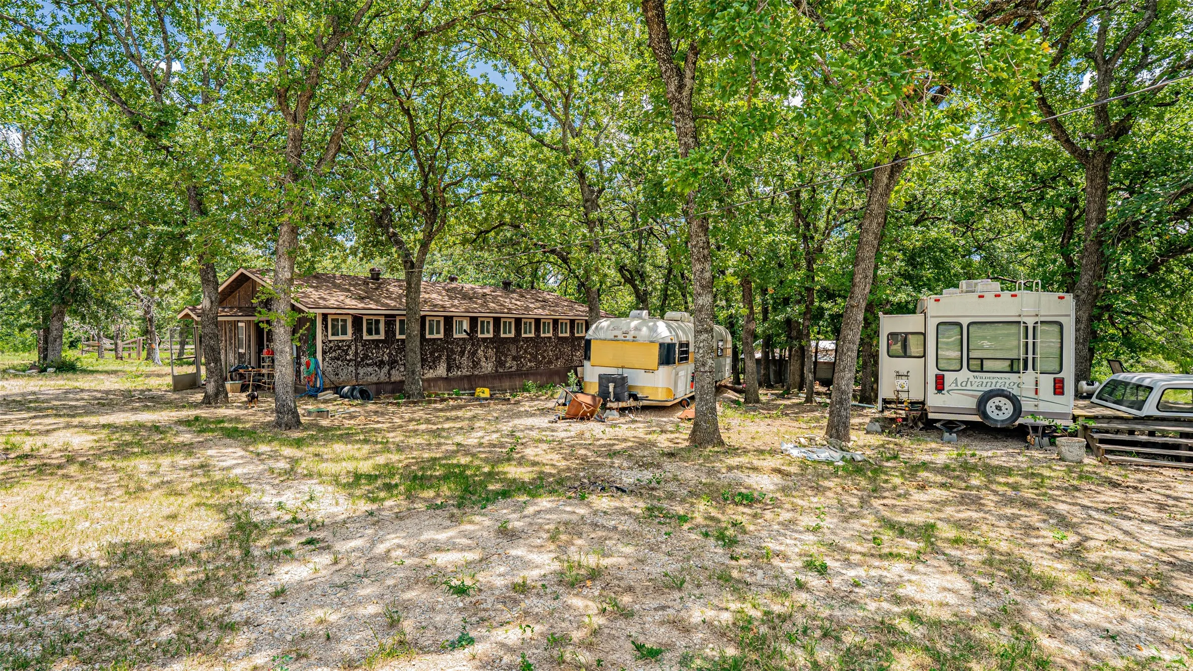 View of yard featuring view of wooded area