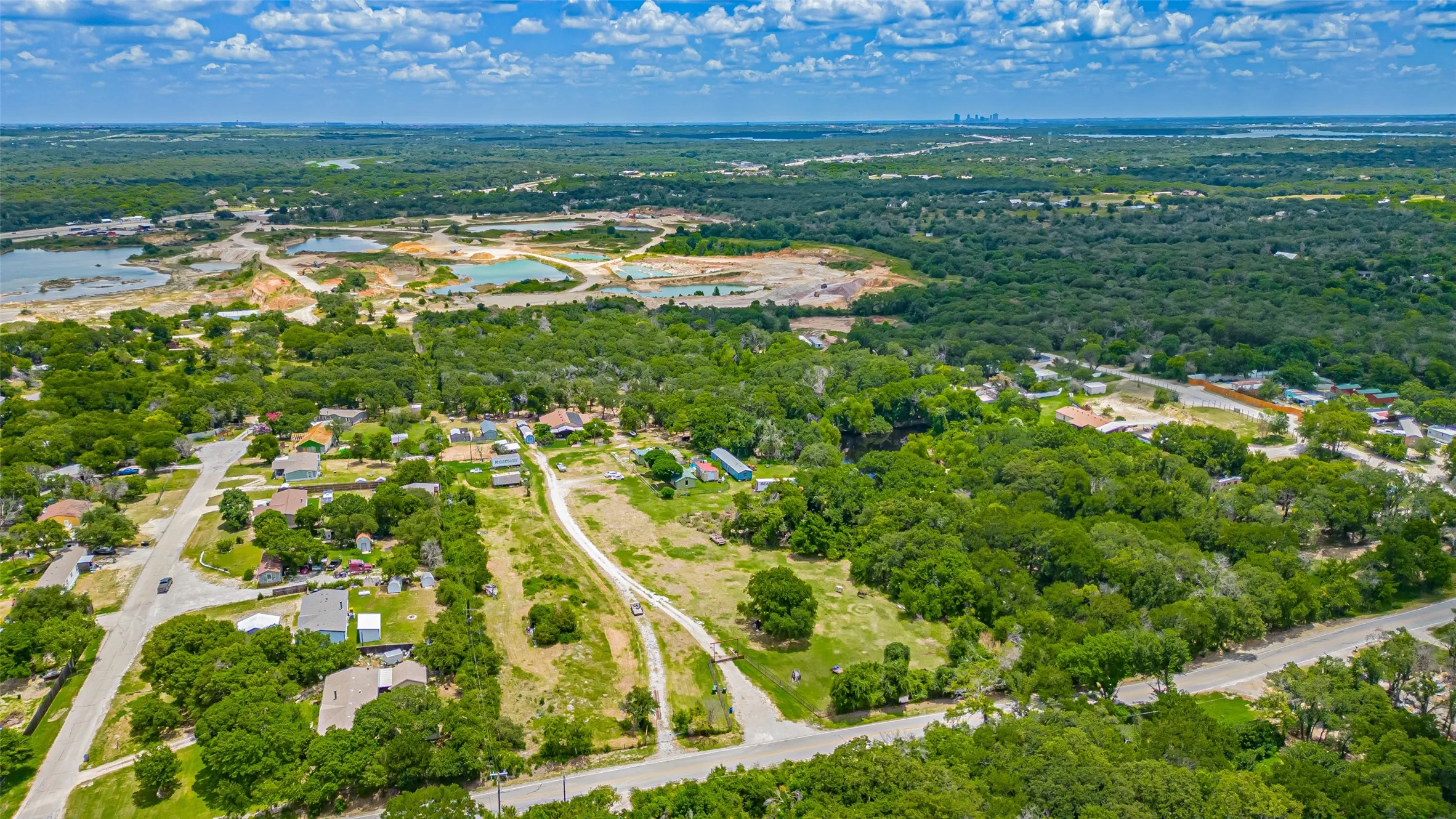 Aerial view of property's location with a large body of water