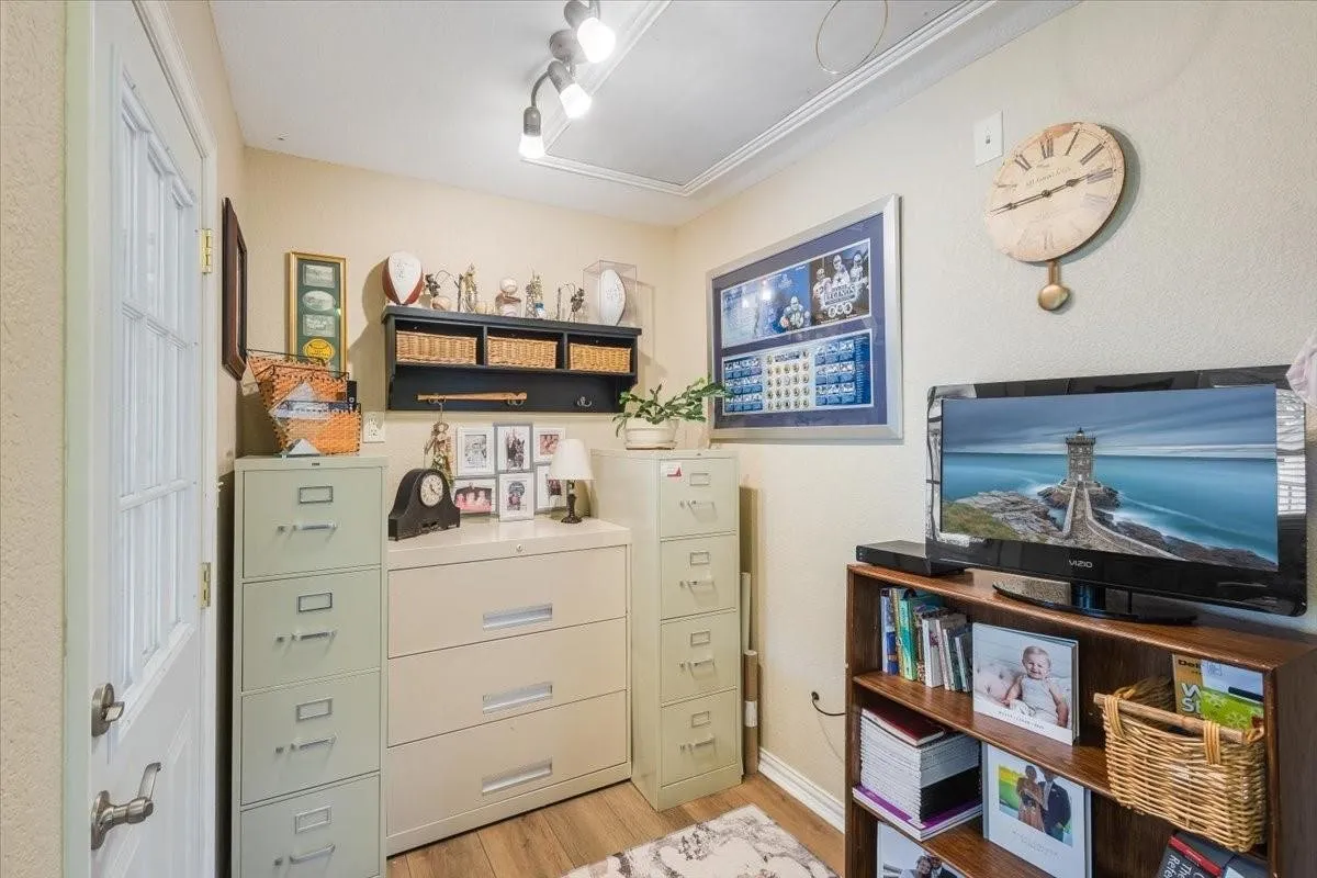 Home office featuring light wood-style floors