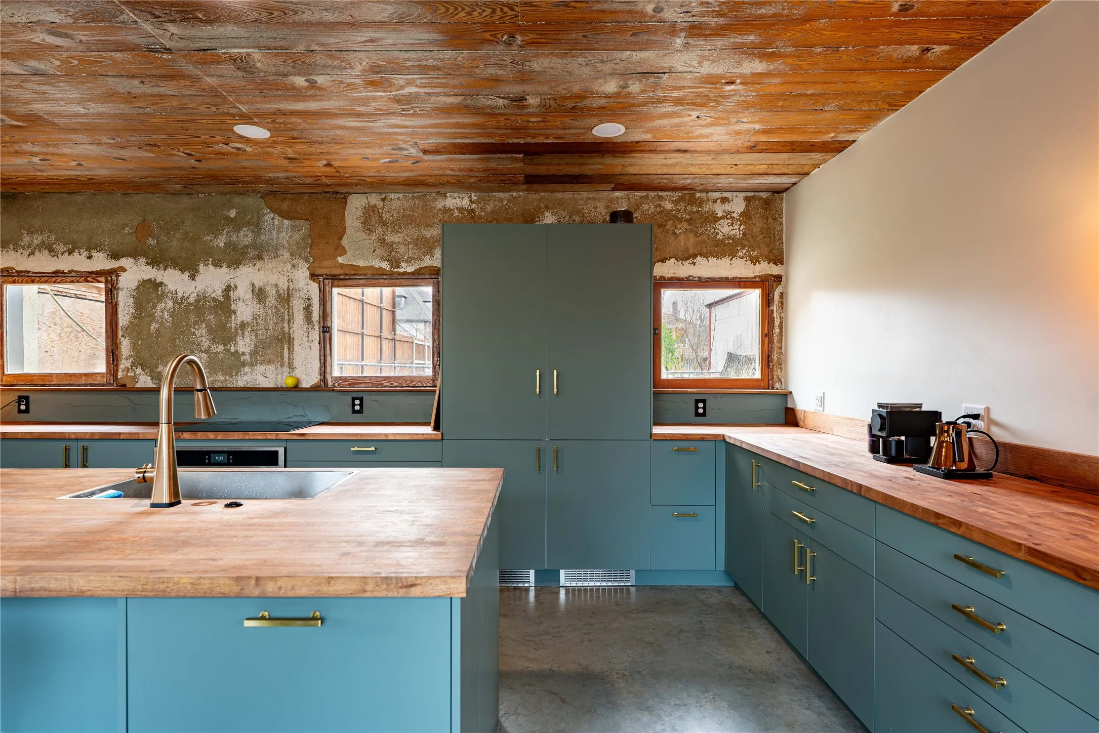 Kitchen featuring a sink, wood ceiling, and butcher block countertops