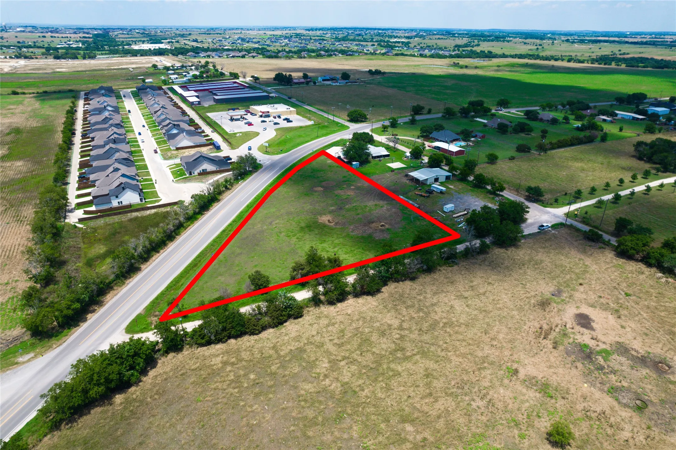 Birds eye view of property featuring a rural view