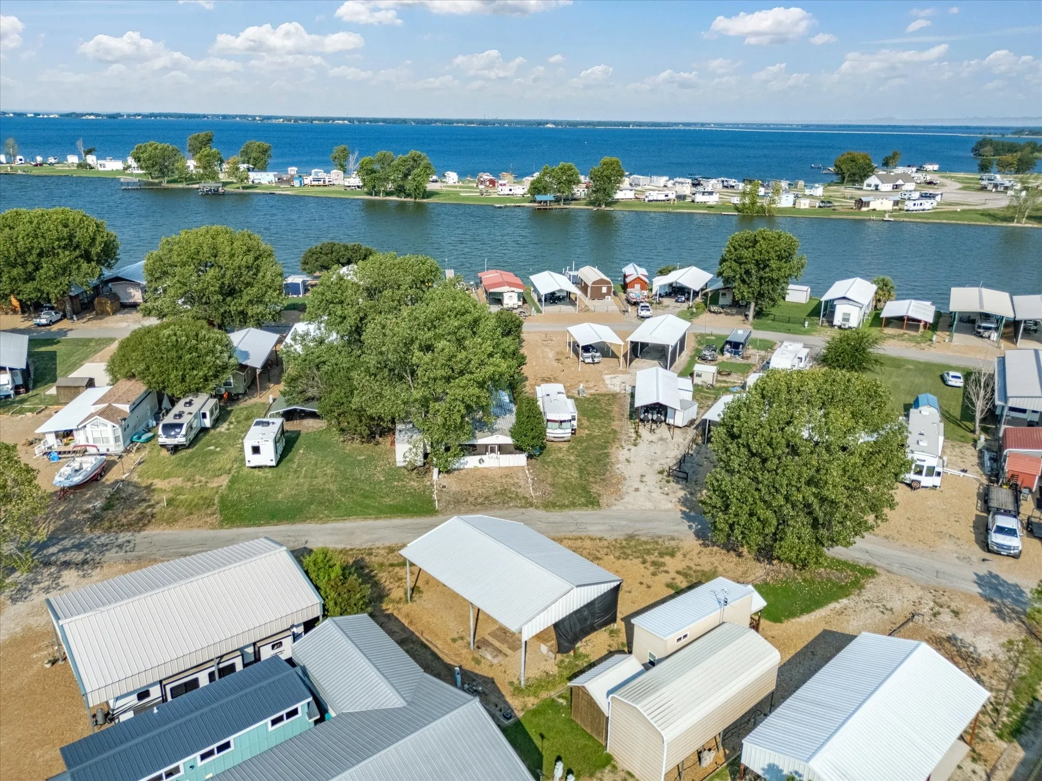Aerial perspective of suburban area with a nearby body of water