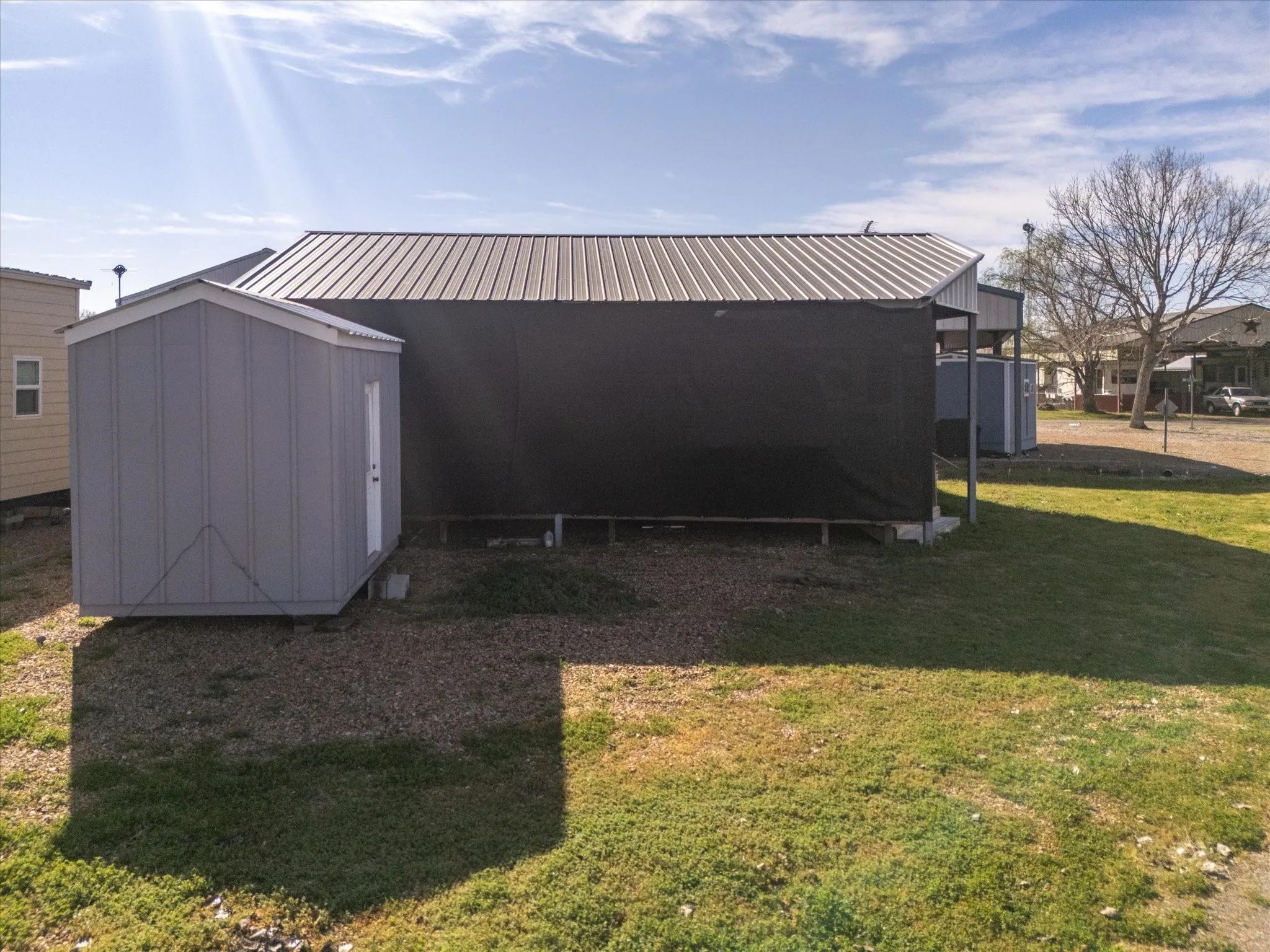 Storage shed removed and not included in purchase
