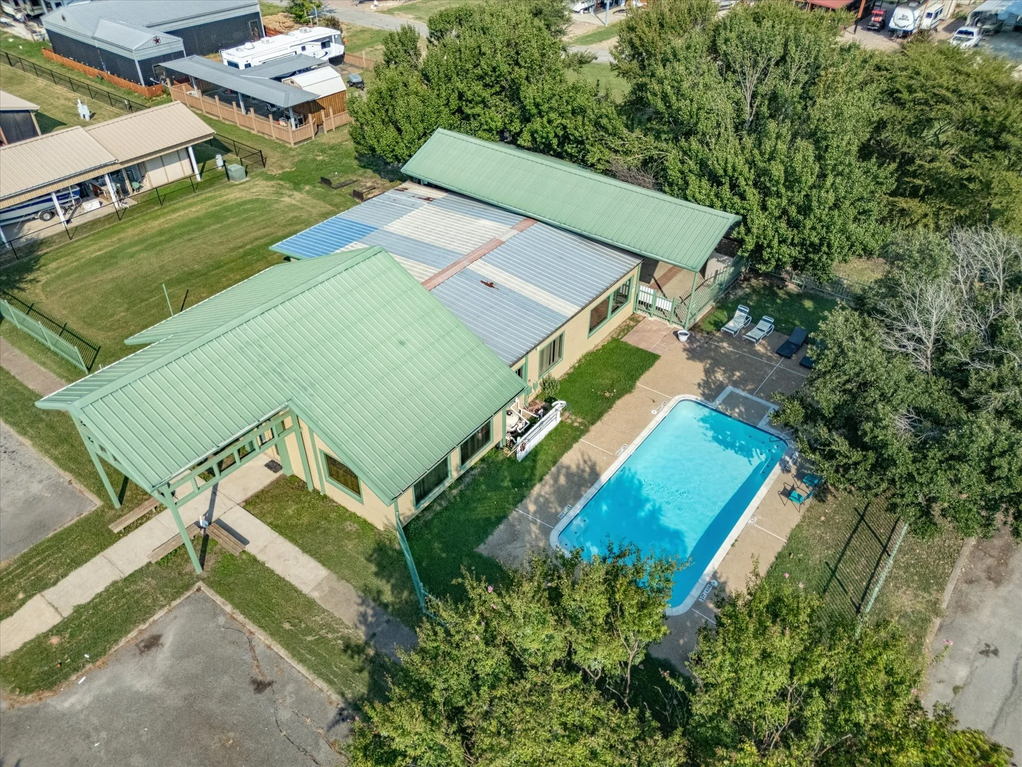 View of subject property featuring a pool area