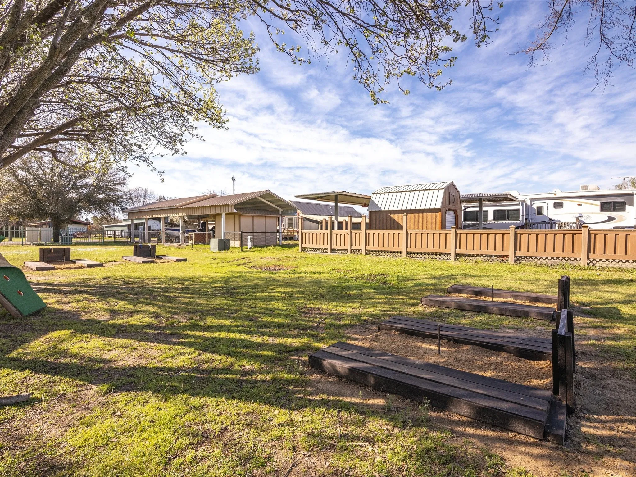 View of yard featuring fence