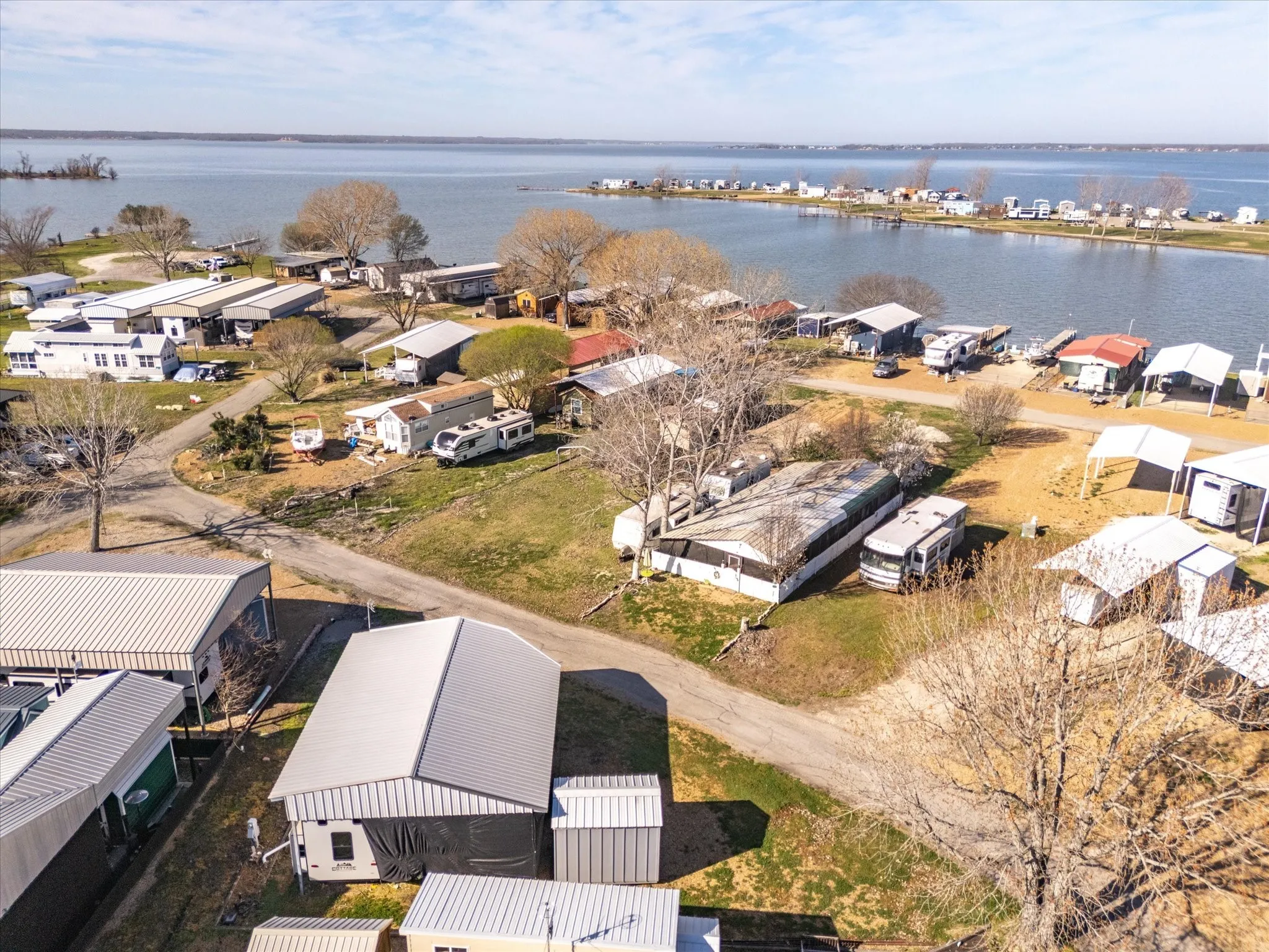 Birds eye view of property featuring a residential view and a water view