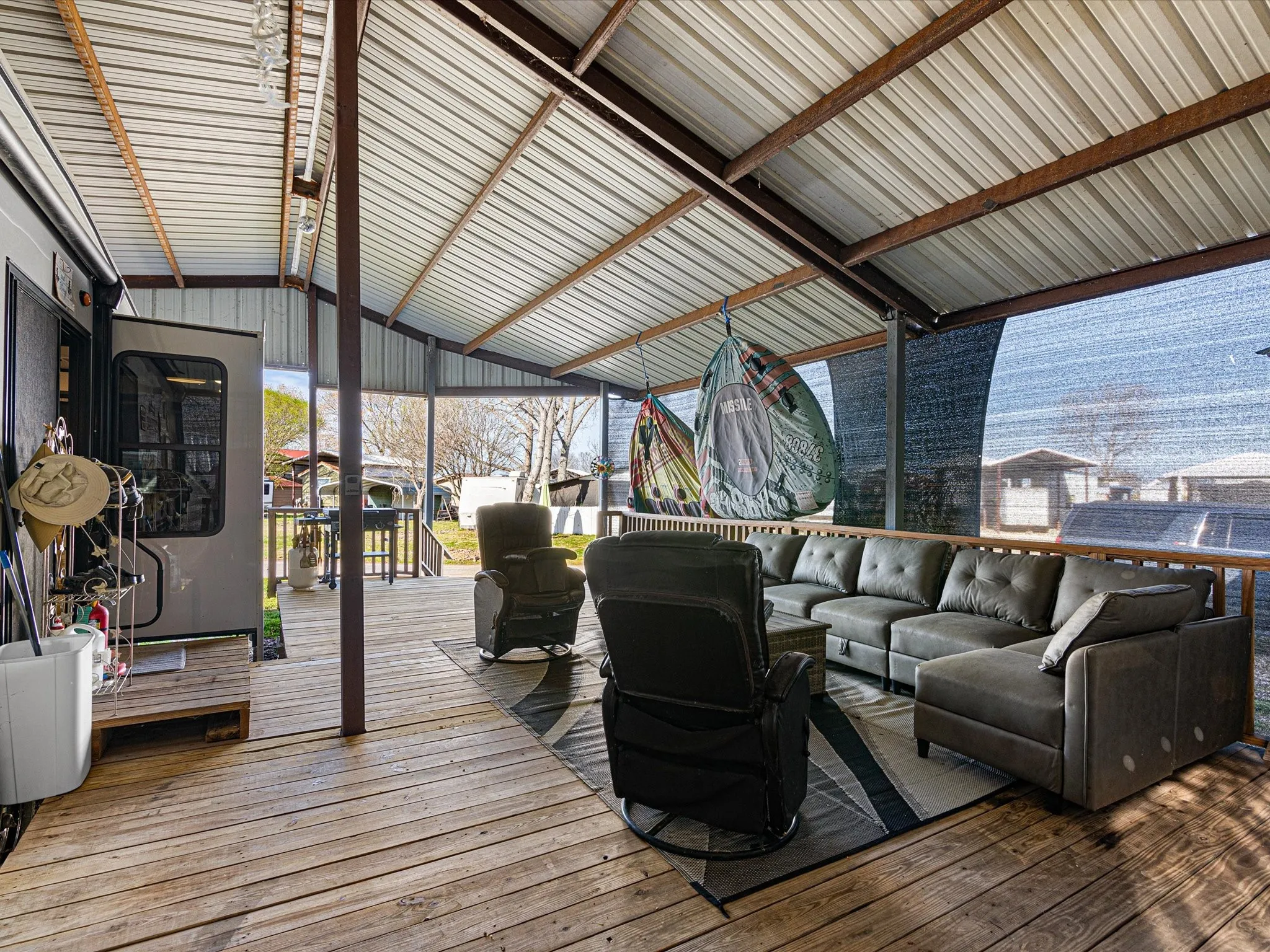 Wooden deck featuring an outdoor living space