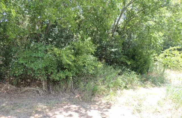 Leading from back of Hwy 69 to connect with CR3303