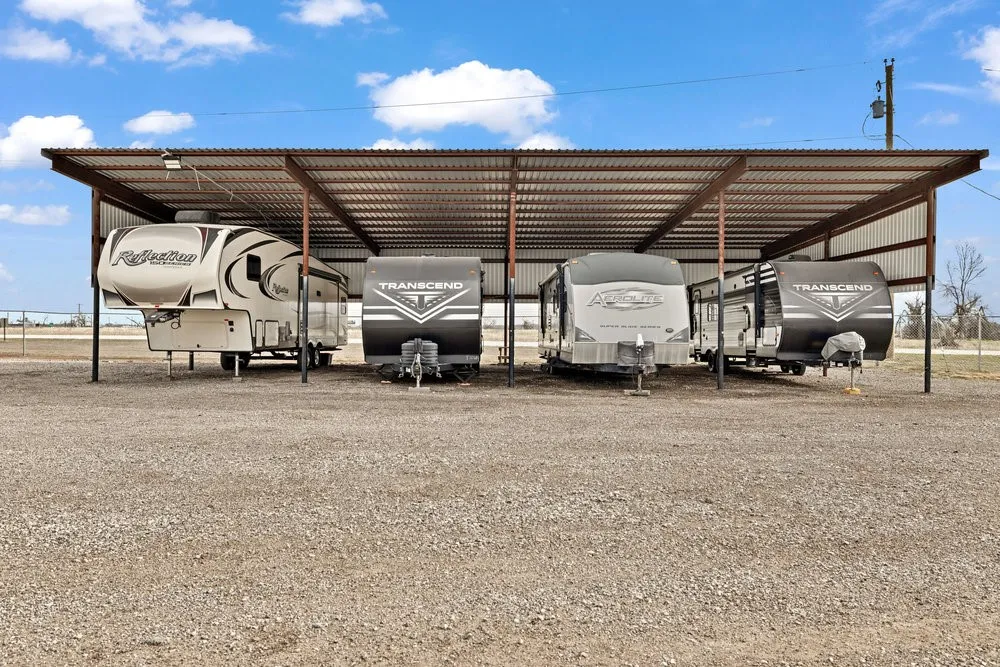 View of parking featuring a carport
