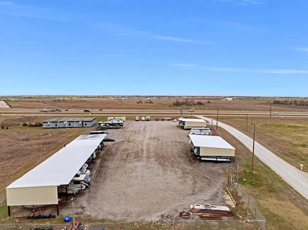Birds eye view of property with a rural view