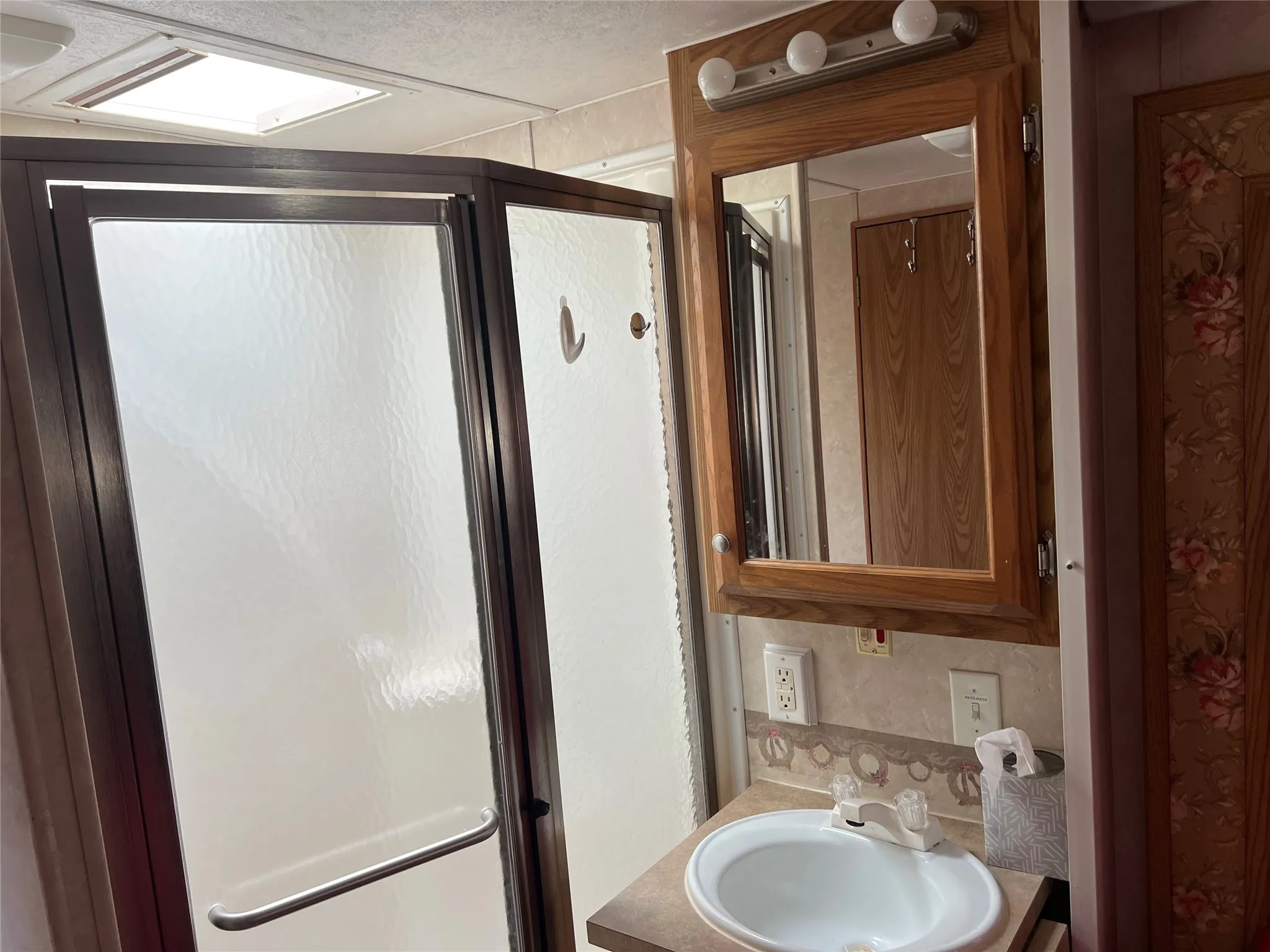 Full bath with vanity and a stall shower