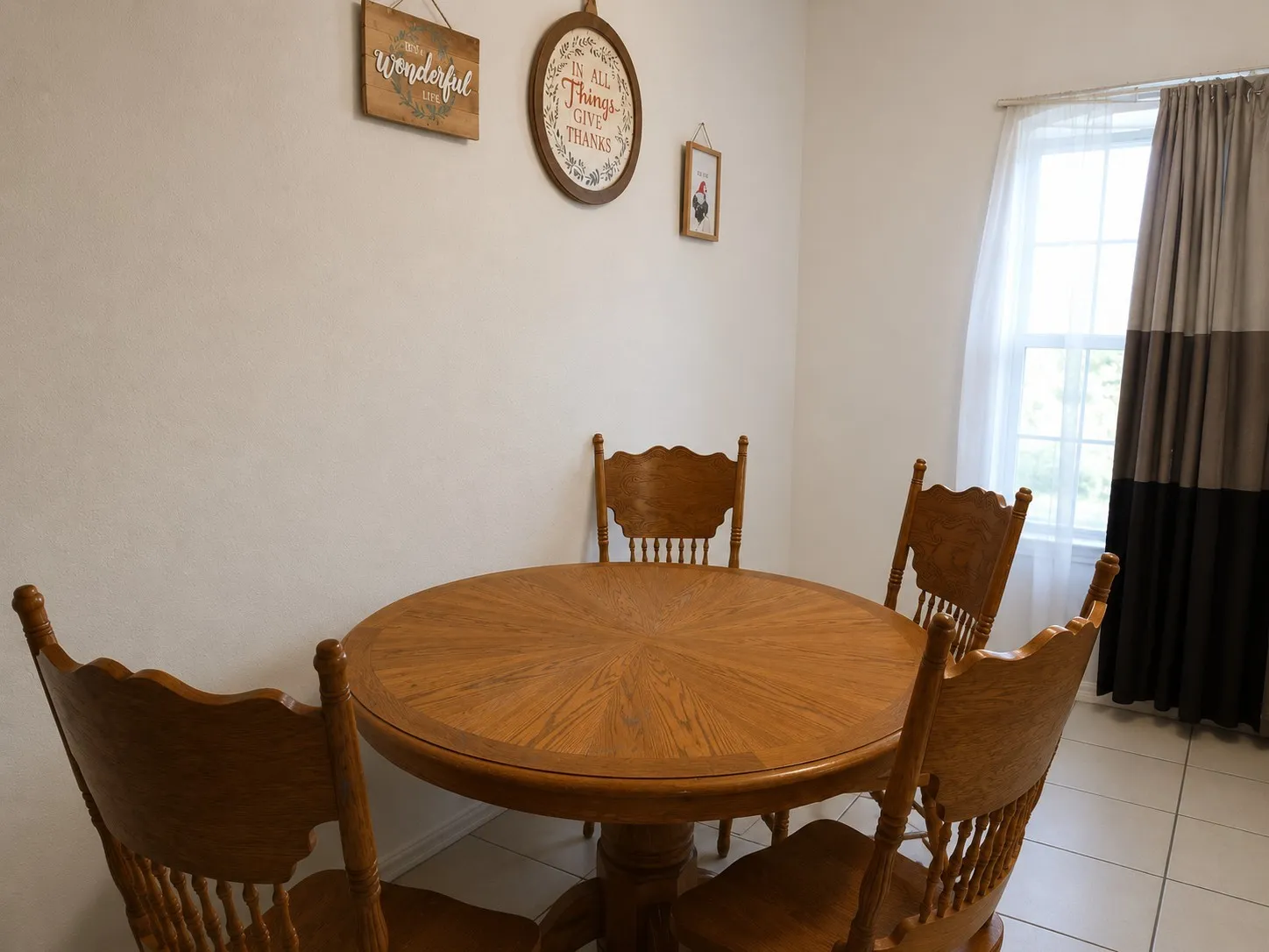 Dining area featuring light tile patterned flooring
