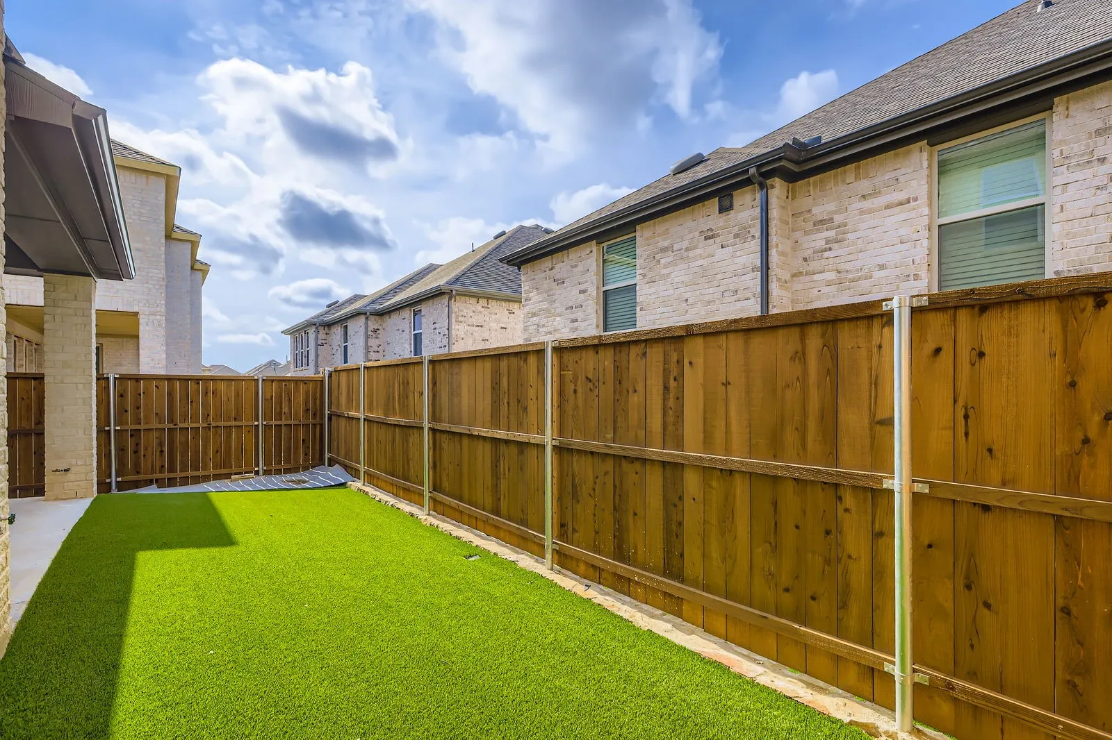 View of fenced backyard