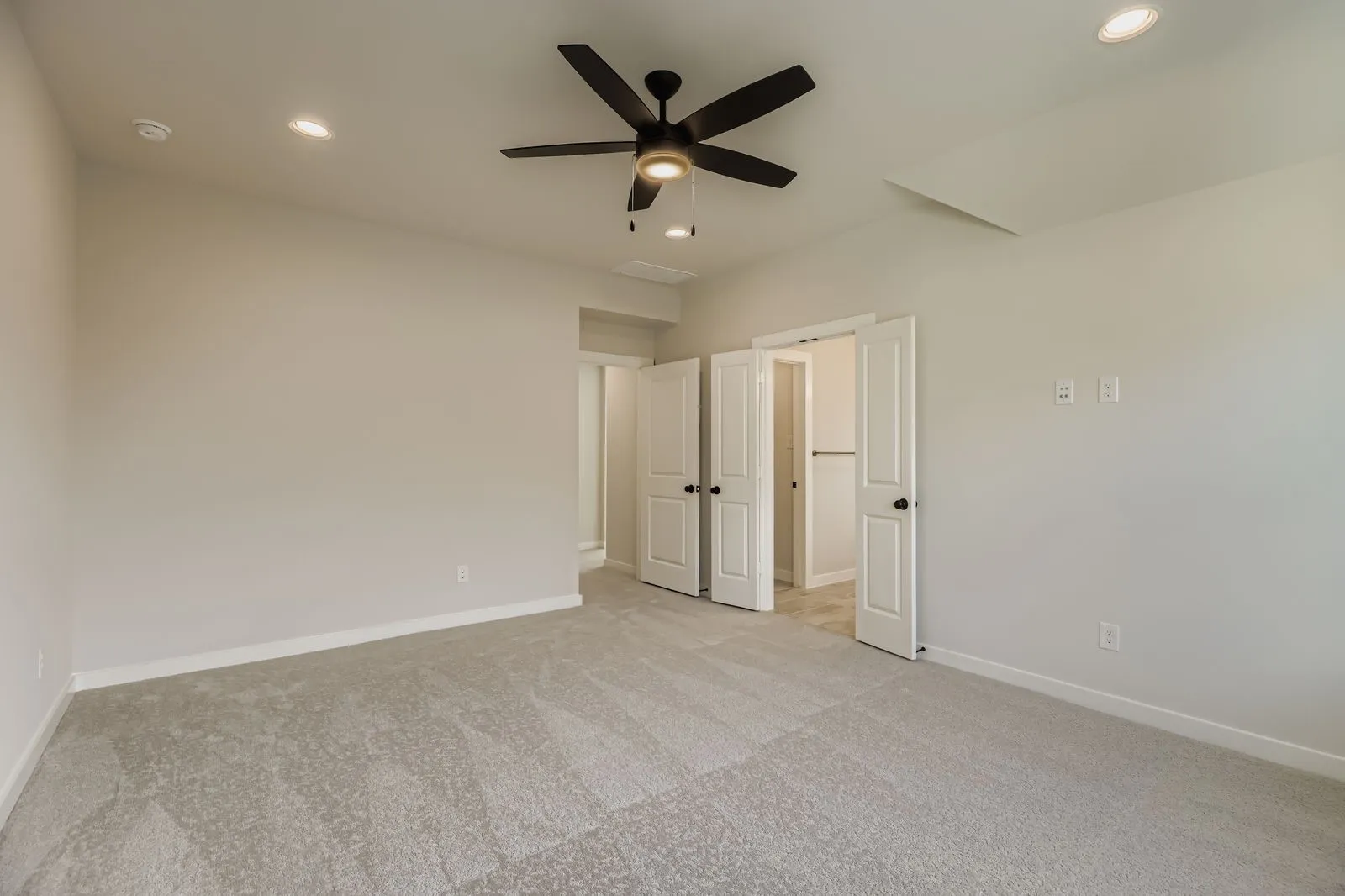 Unfurnished bedroom with light carpet, recessed lighting, and ceiling fan