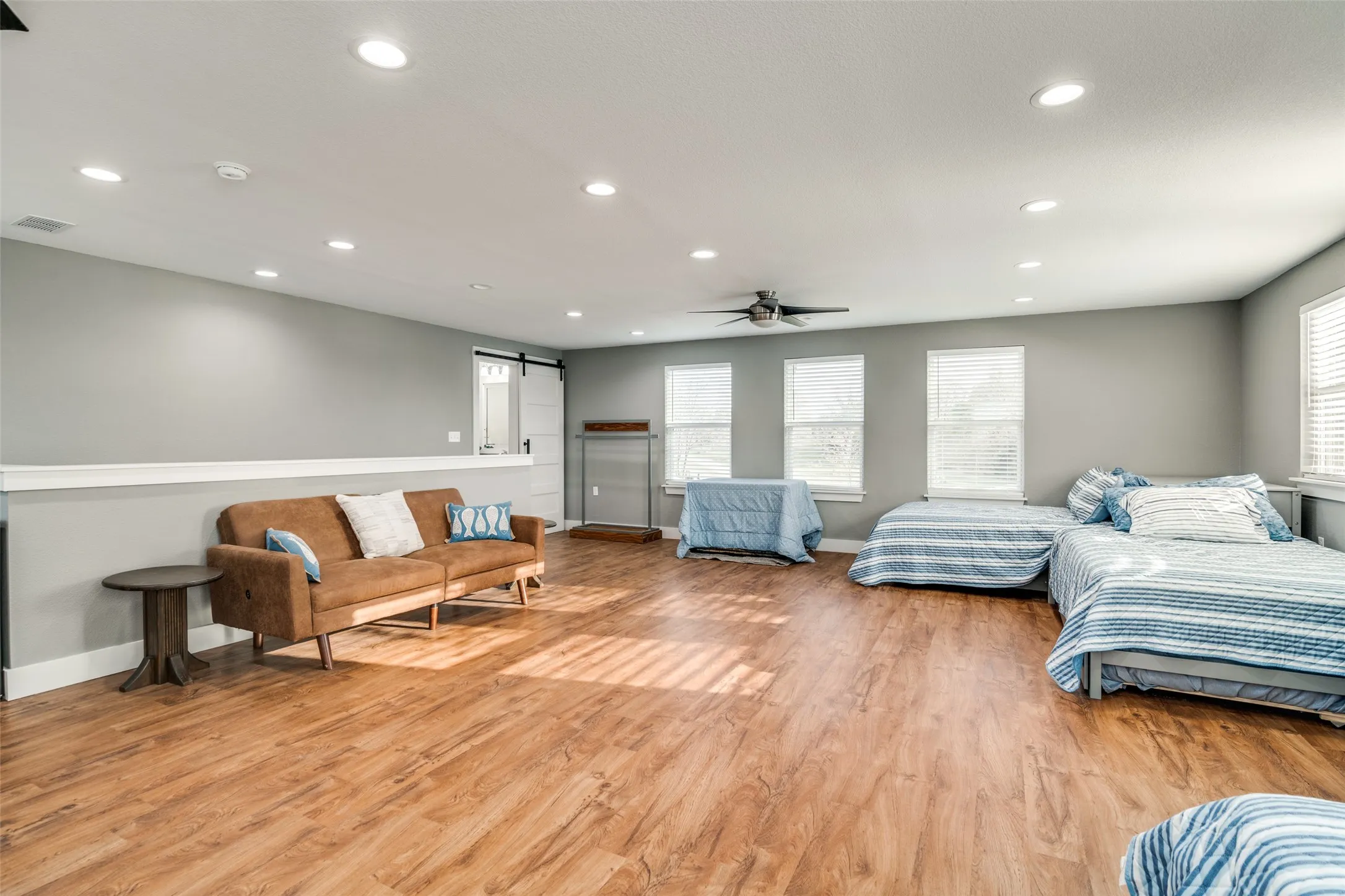 Bonus Room upstairs with multiple windows with expansive lake views and wood floors