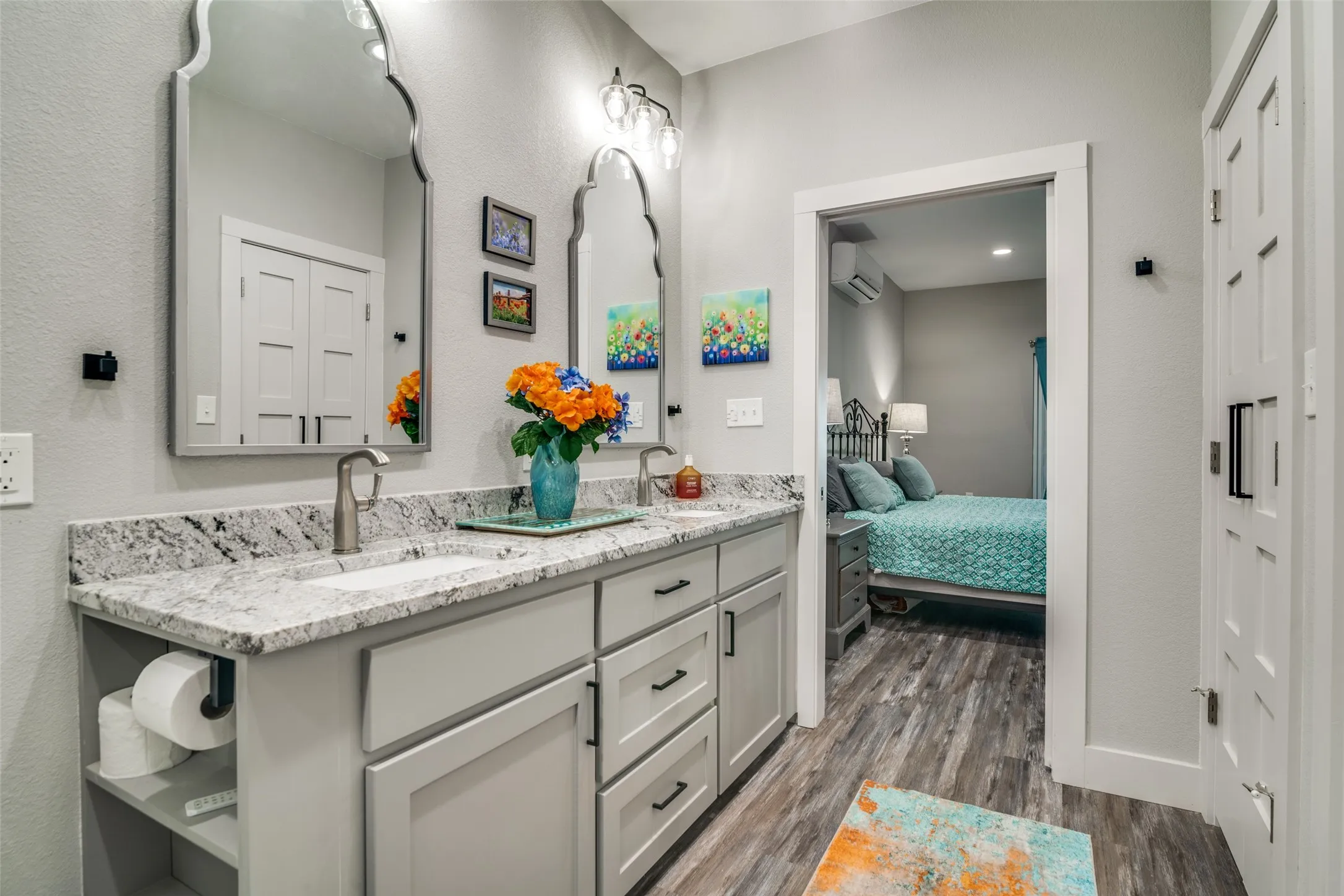Ensuite bathroom featuring a sink, double vanity,  linen closet and closet