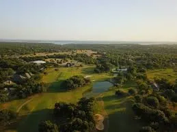 Aerial view of property's location with a local golf course