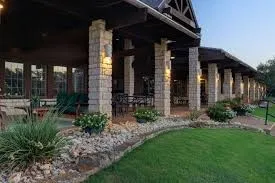 View of side of home featuring a lawn