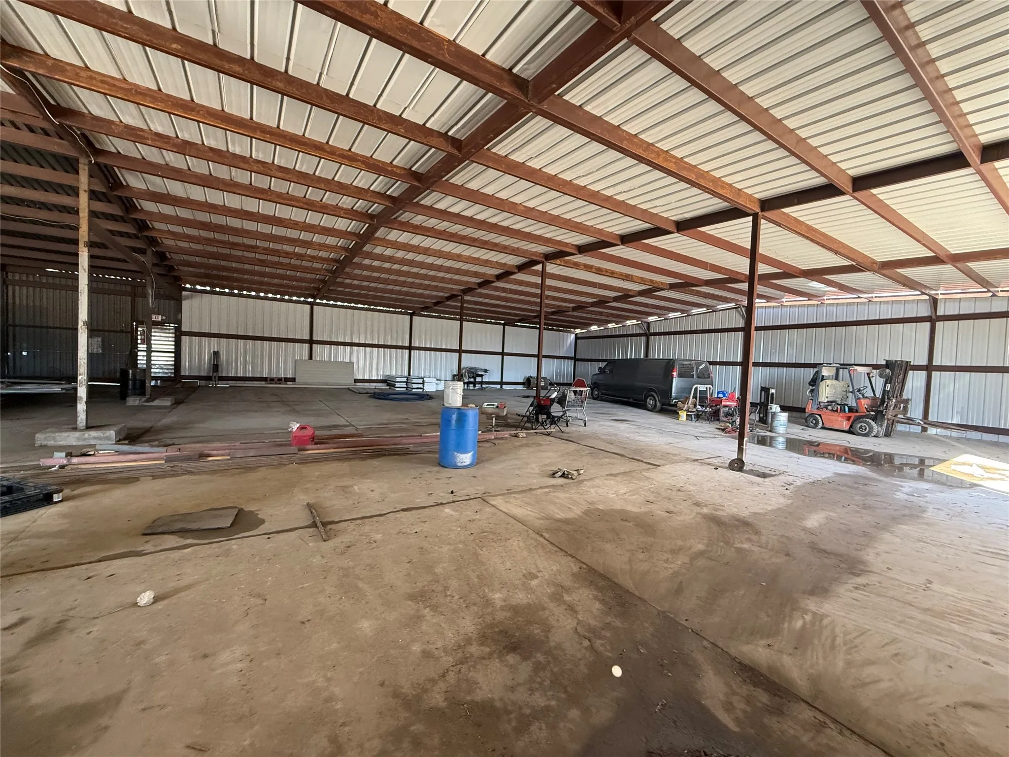 Garage featuring metal wall