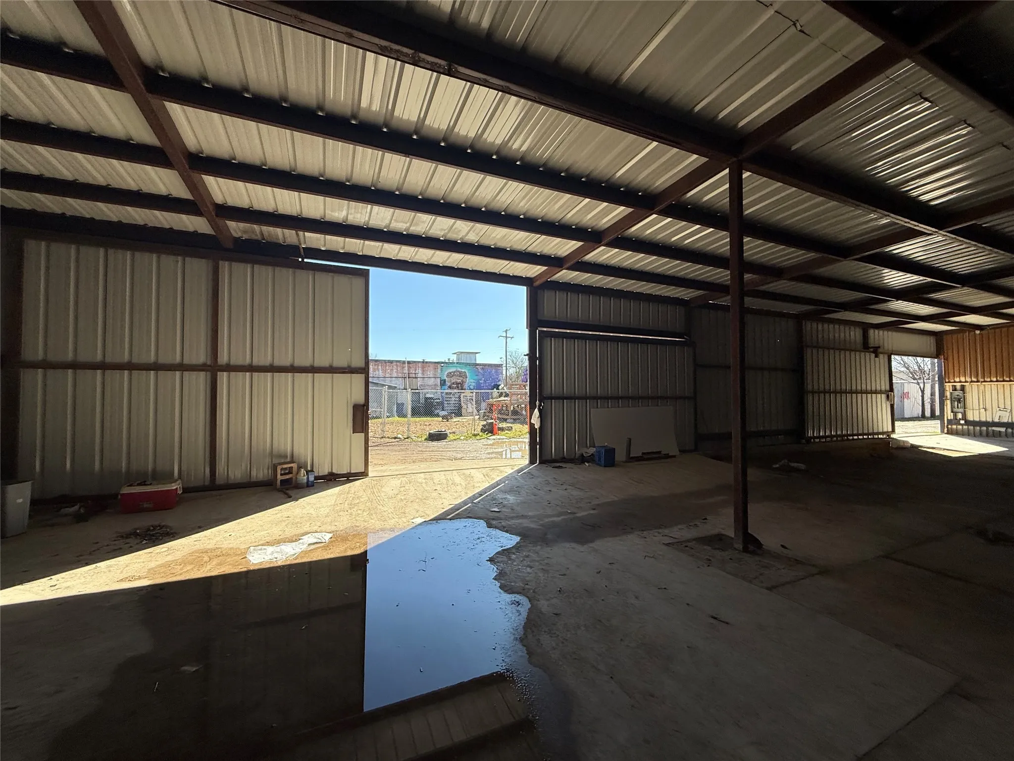 Garage with metal wall and a view of city
