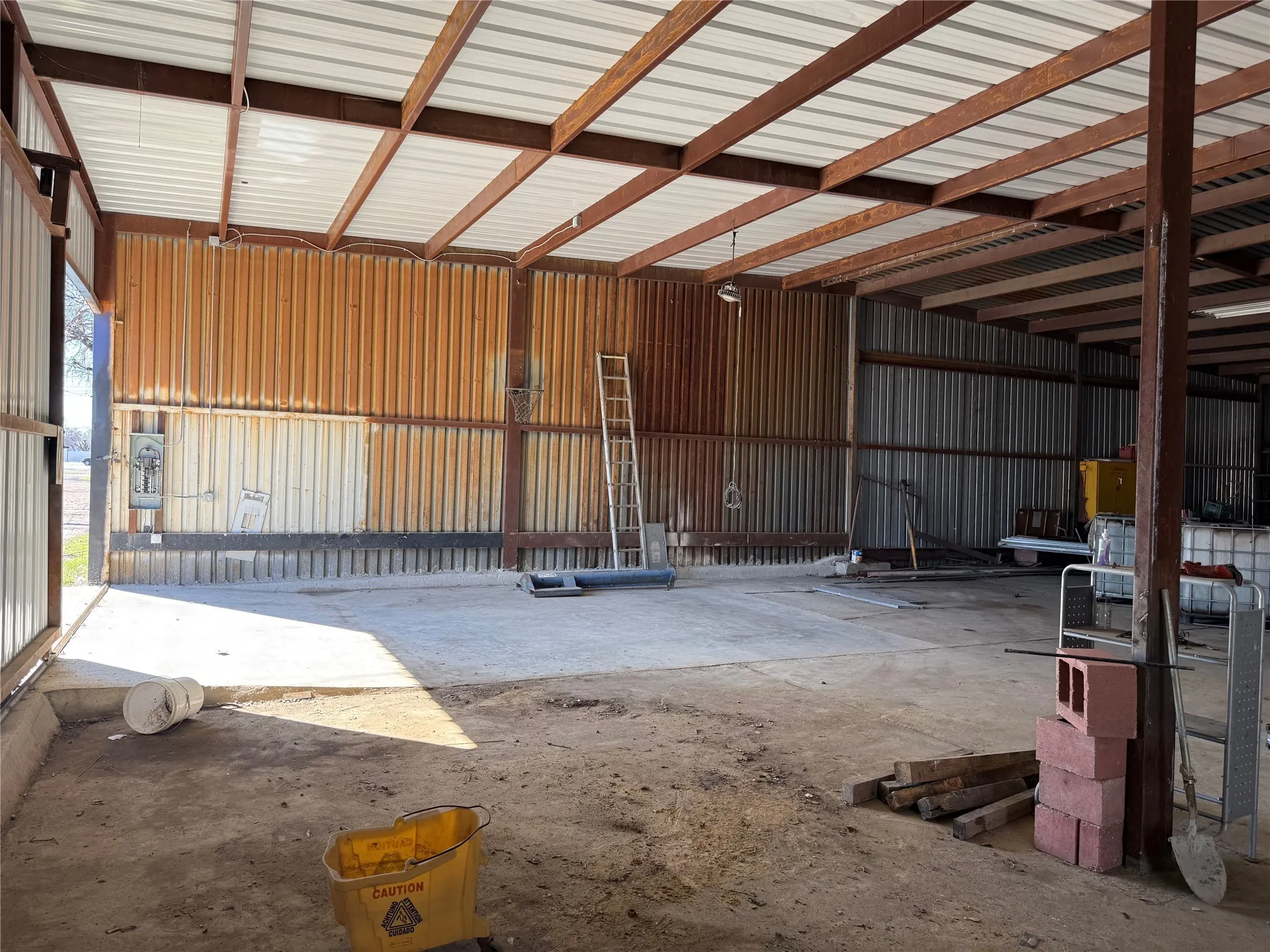 Garage featuring metal wall