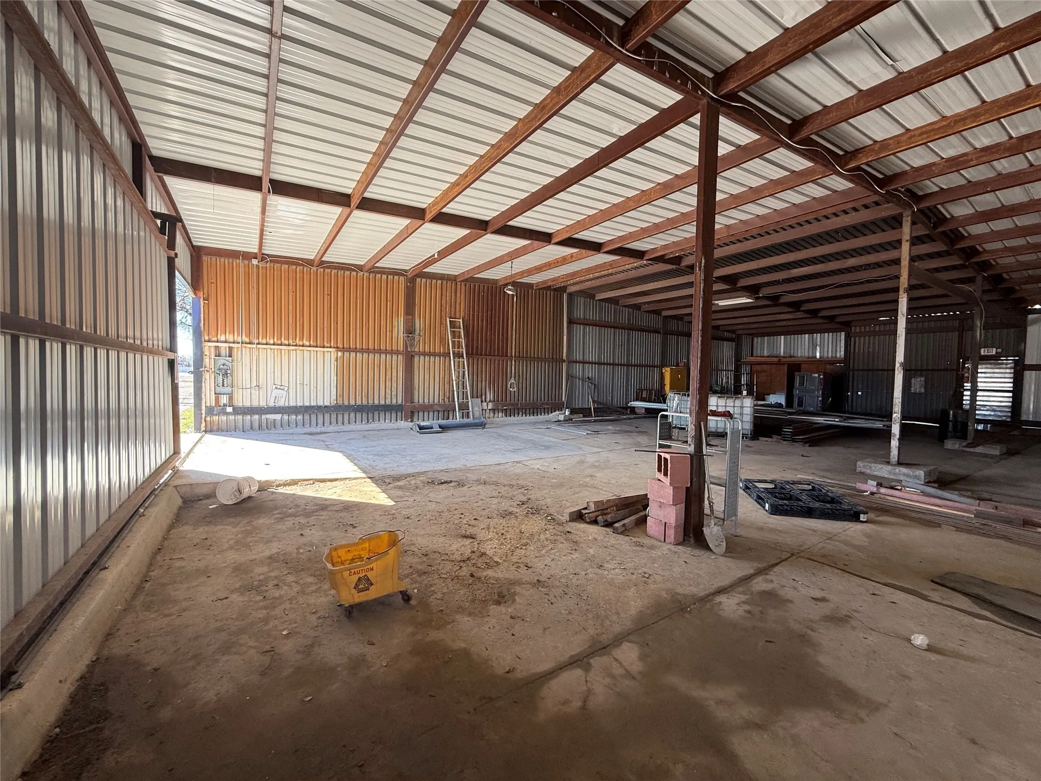 Garage featuring metal wall