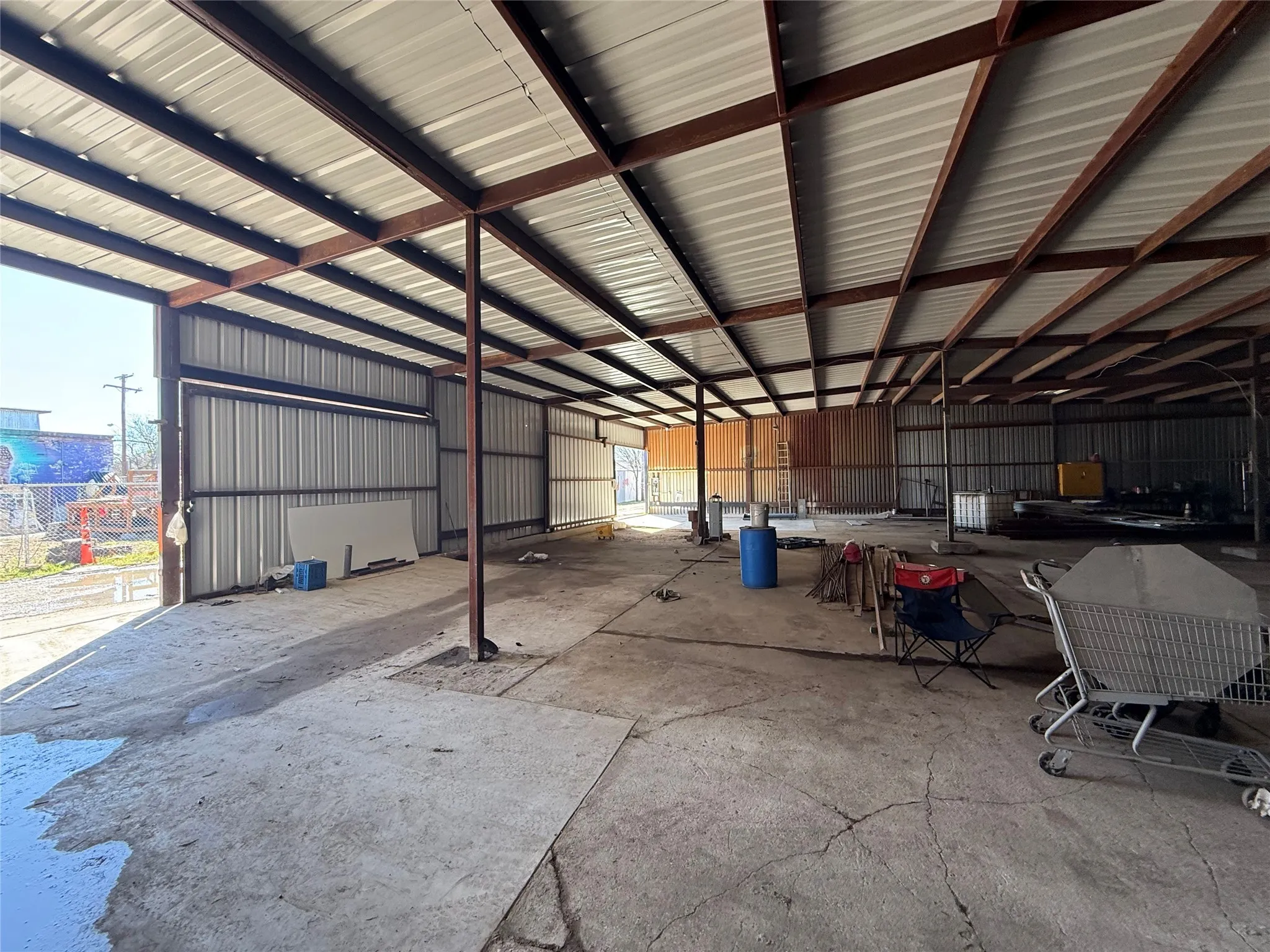 Garage featuring metal wall