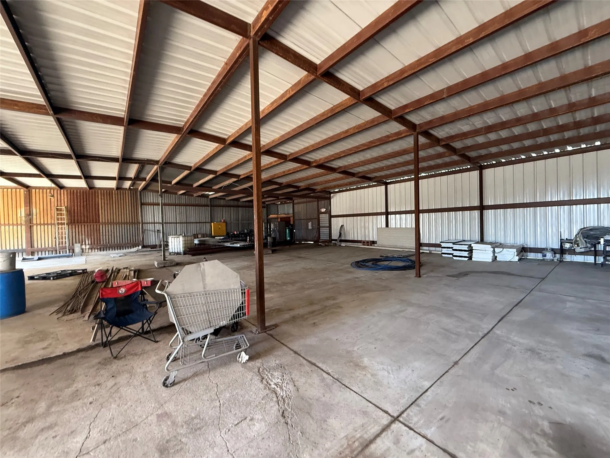 Garage featuring metal wall