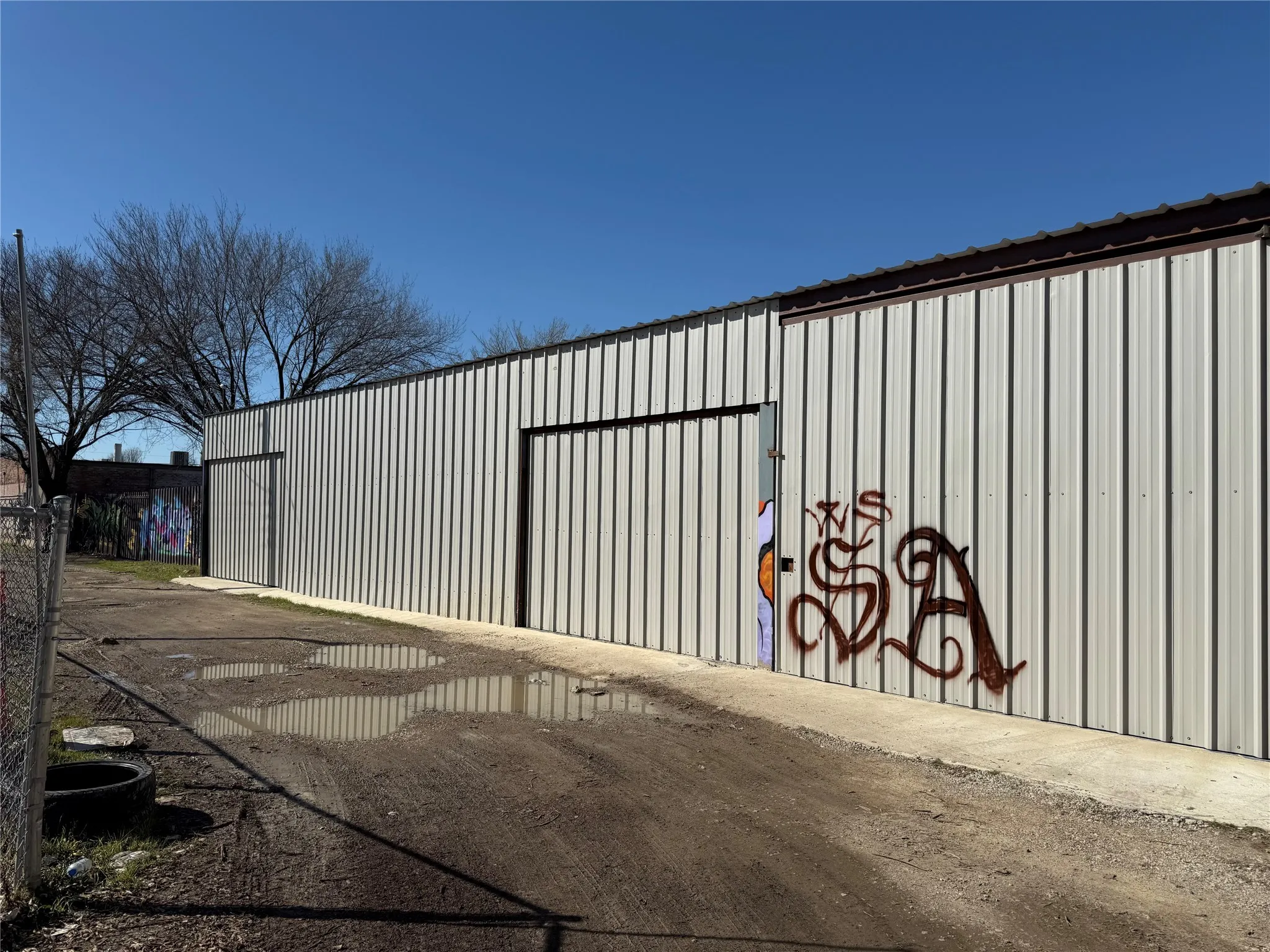 View of gate featuring an outdoor structure
