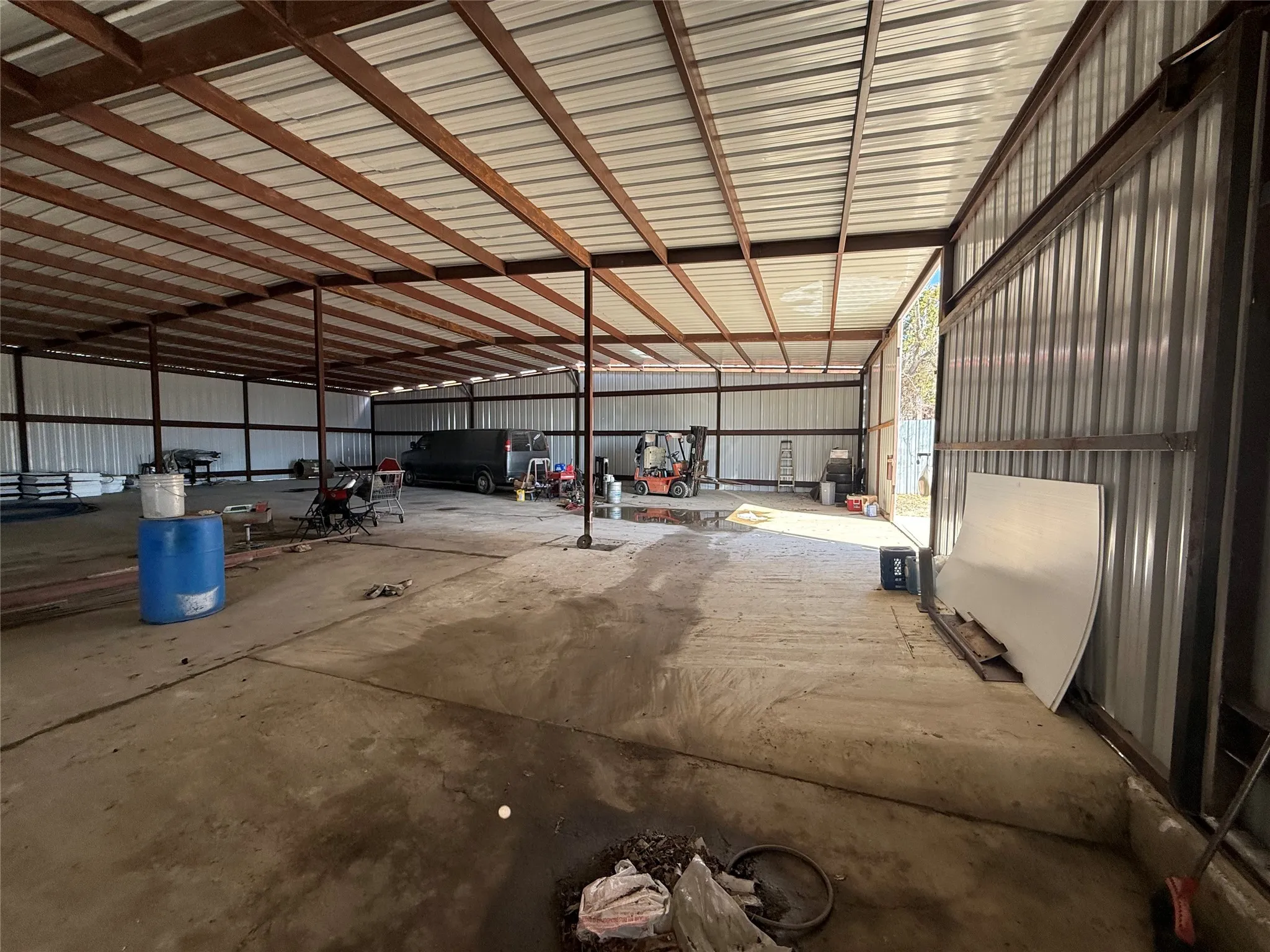 Garage featuring metal wall
