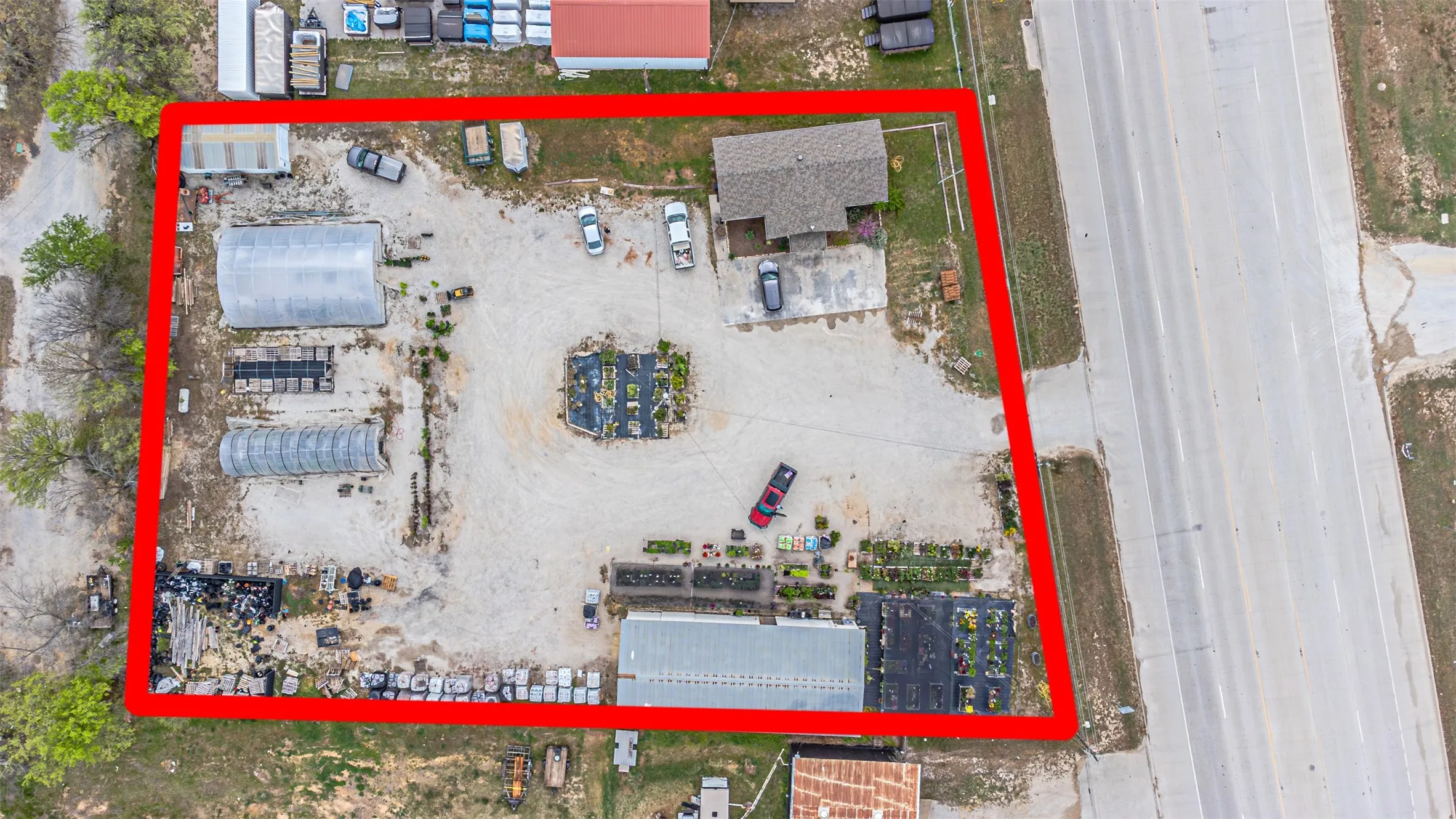 Aerial View shows all buildings on hard packed gravel pad