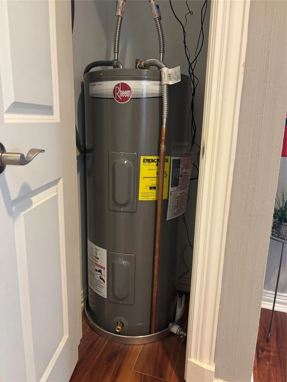 Utility room featuring water heater