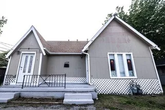 Rear view of house with covered porch